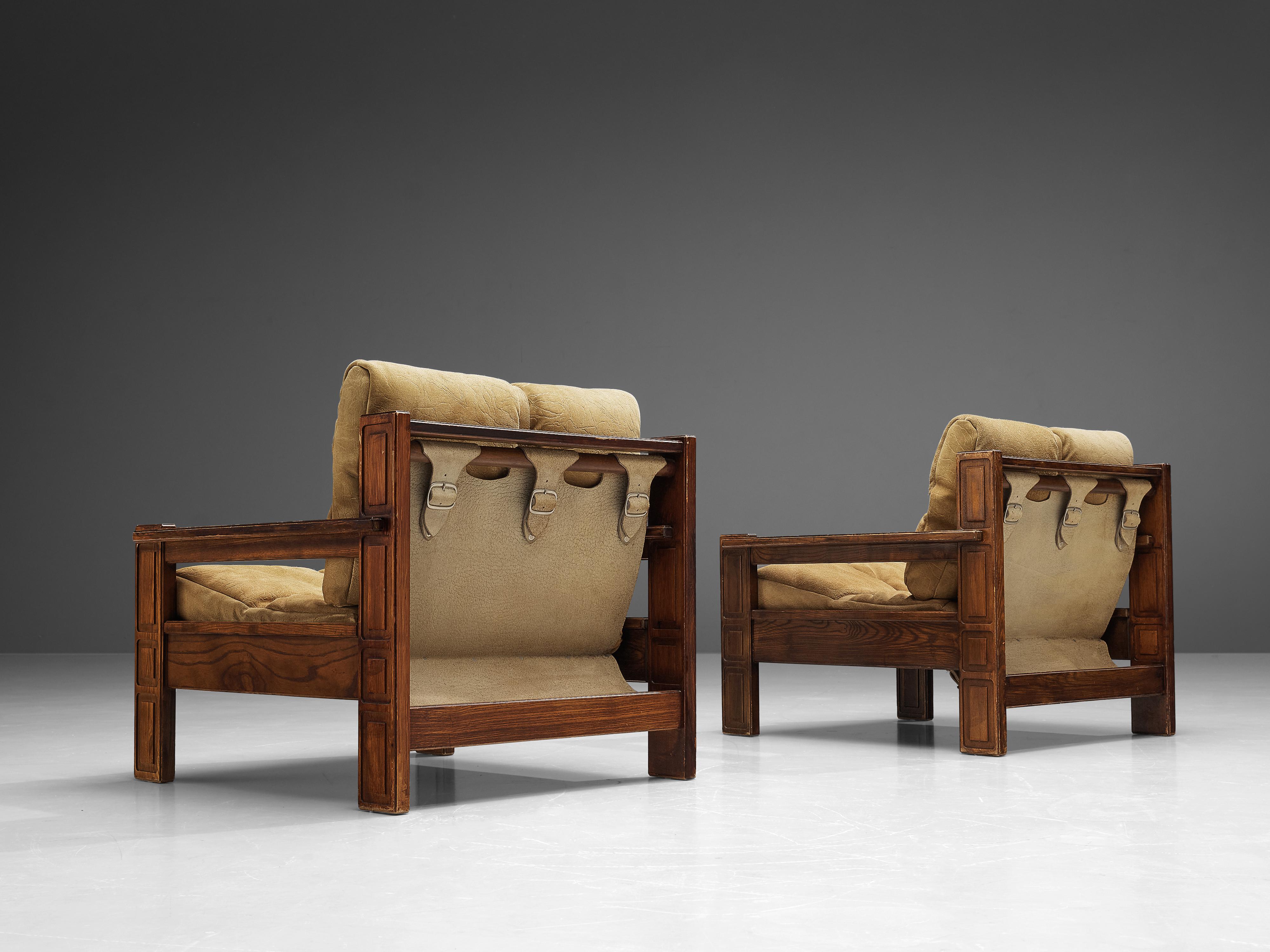 Carl Straub, lounge chairs, ash, suede, fabric, metal, Germany, 1970s

This pair of German lounge chairs bears multiple features. The first eye-catch are the two loose cushions in patinated suede. These are structured with a vertical and horizontal
