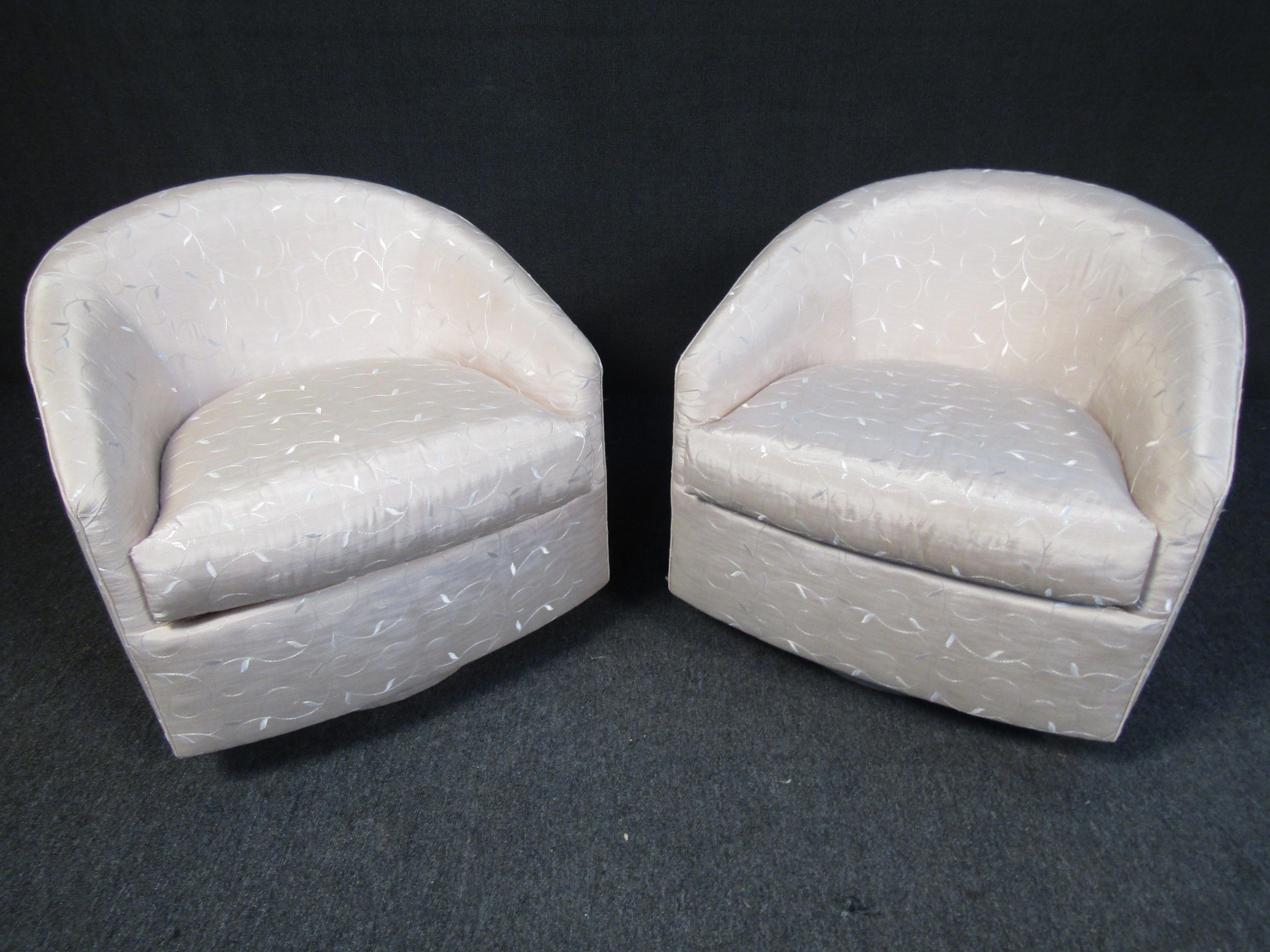 This vintage pair of lounge chairs by Directional feature a shimmering upholstery with embroidered floral designs throughout. A half-round back and cushioned seat offer a comfortable spot to sit in any room. 
Please confirm item location with seller