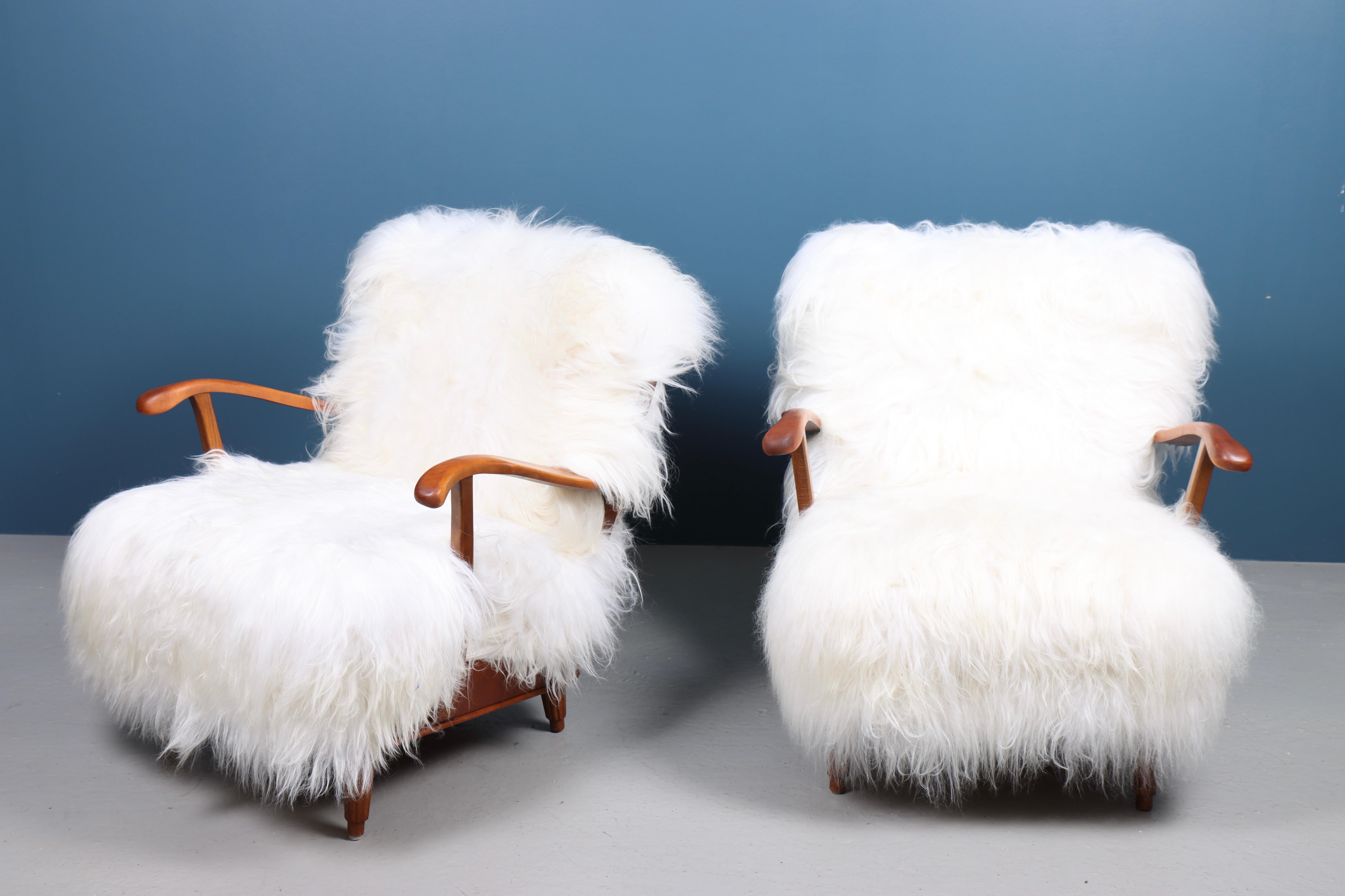 Danish Pair of Lounge Chairs with Sheepskin, Made in Sweden 1950s