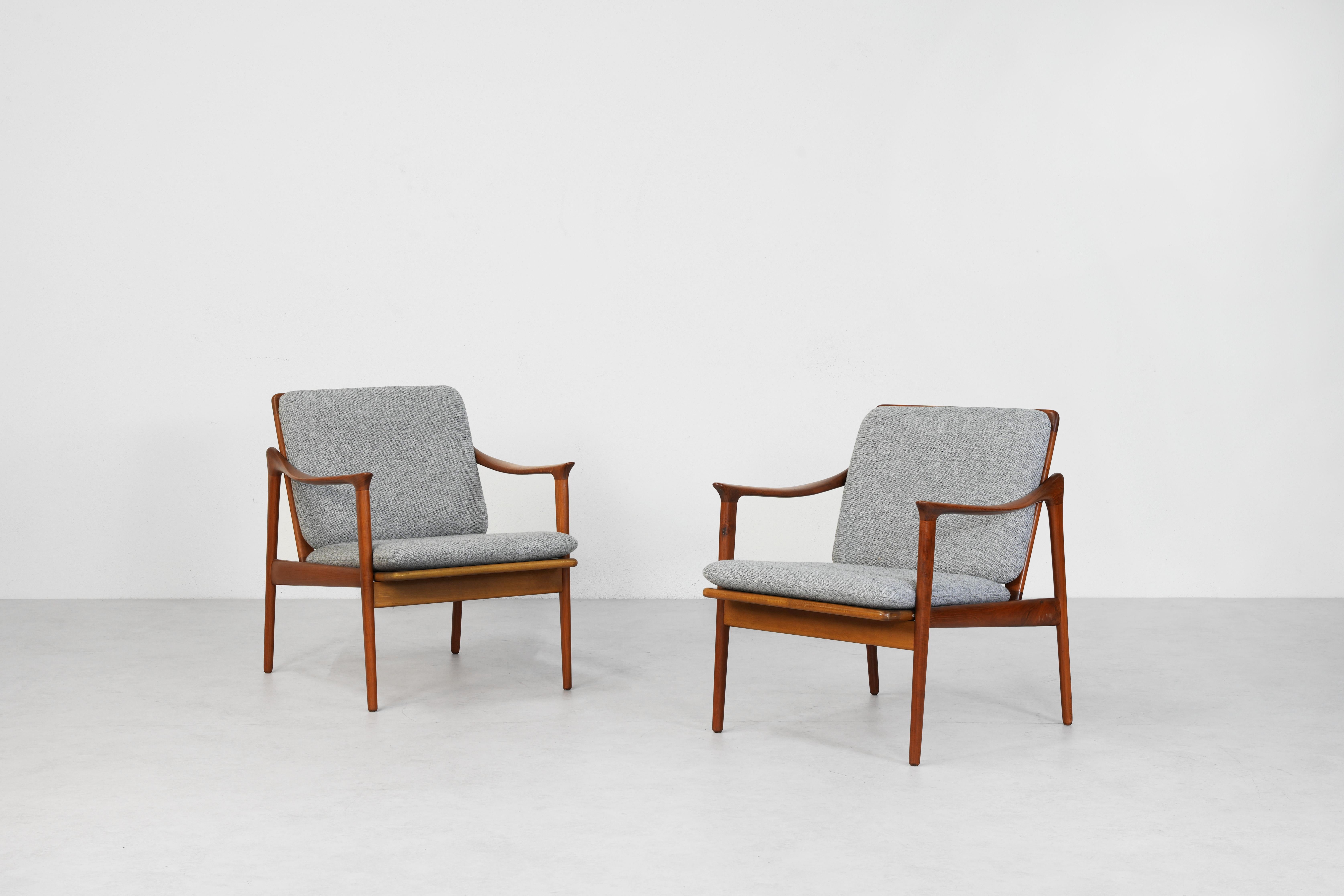Beautiful pair of lounge and easy chairs designed by Fredrik A. Kayser and manufactured by Vatne Møbler in the 1960s in Norway. Both chairs feature a teakwood frame with extraordinary swung armrests and are in excellent condition.