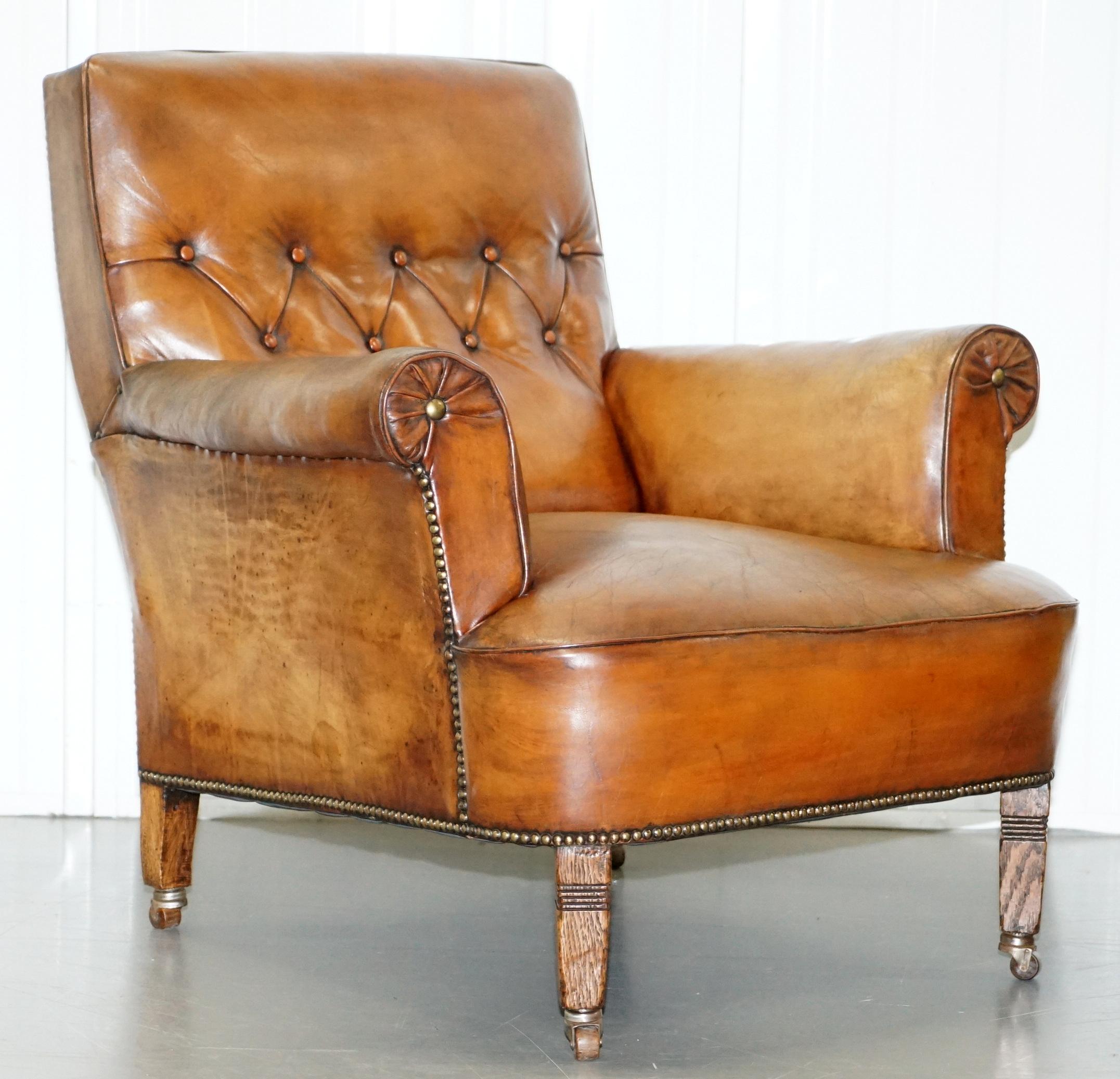 We are delighted to offer for sale this exceptional pair of very rare library reading armchairs with hand dyed brown leather upholstery

A very good looking well made and decorative pair of Library armchairs, these are the quintessential English