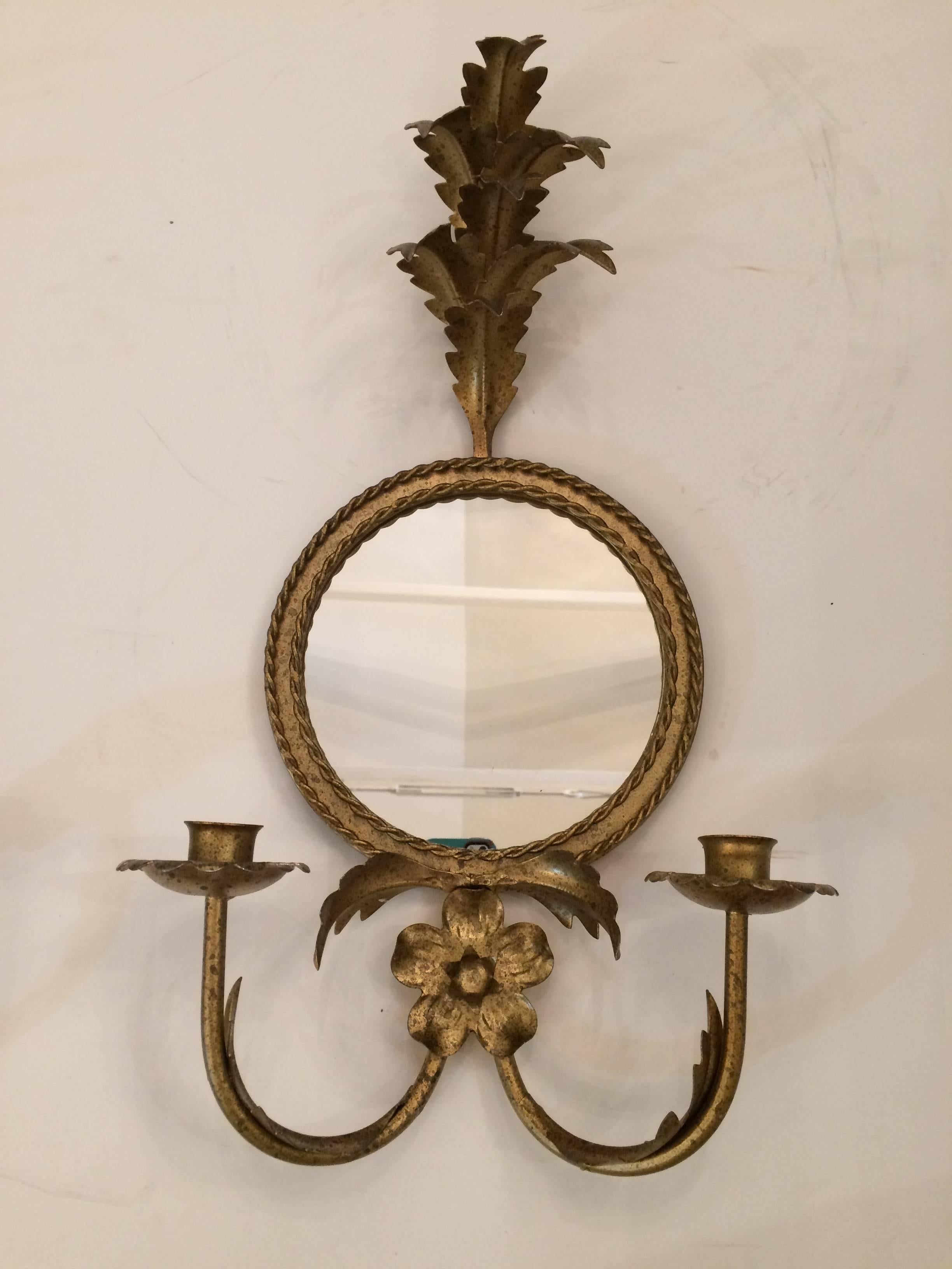 Two glamorous gilt iron and tole candle wall sconces (could be electrified) having a palm frond motif and 7.5 inch diameter round mirrors.