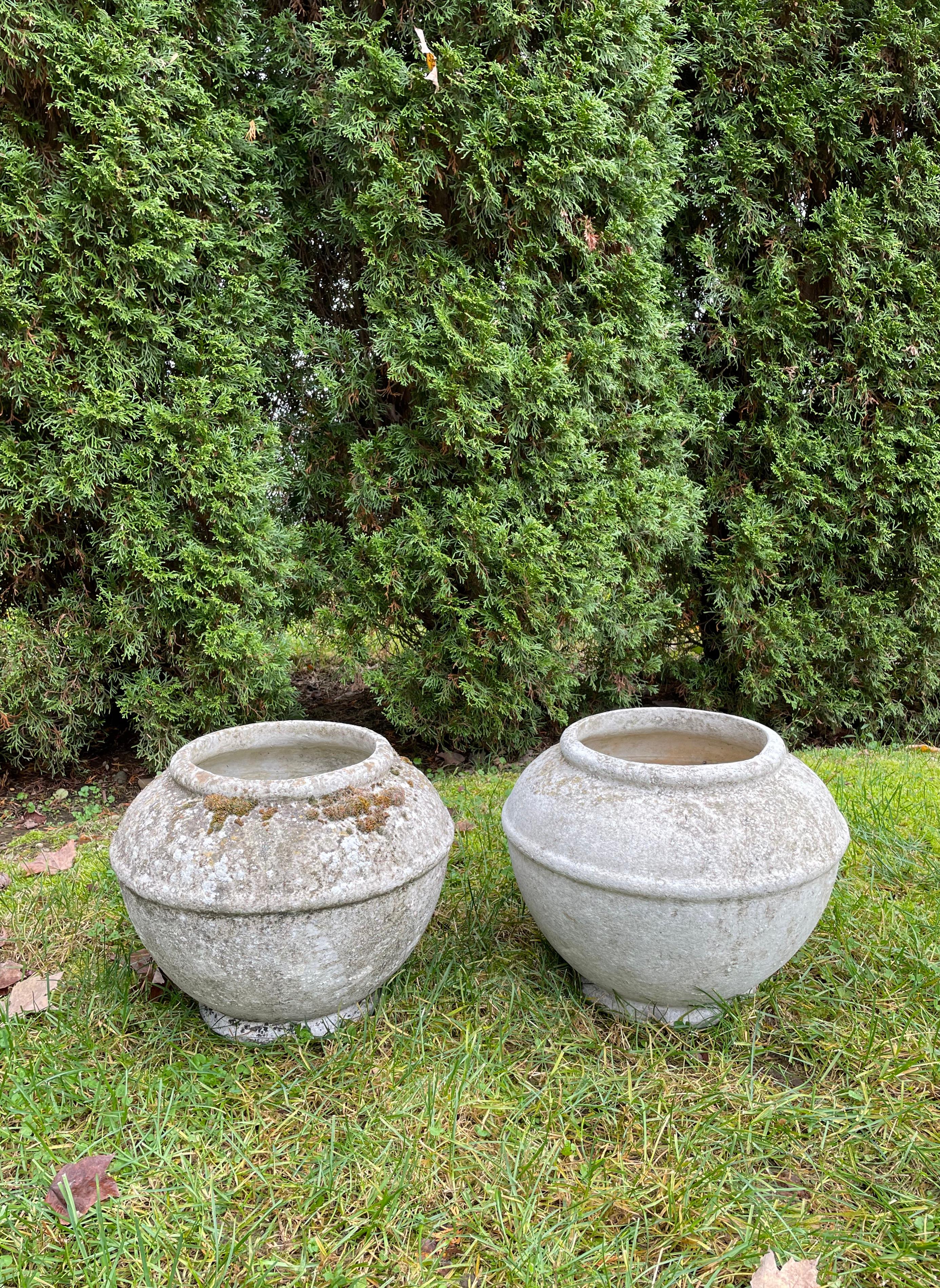 Designed by the iconic Willy Guhl in the 1960s and made of strong and lightweight fiber cement by Eternit, SA of Switzerland, these rounded planters sport great patina and are in excellent condition. Perfect on a dining or console table, they would