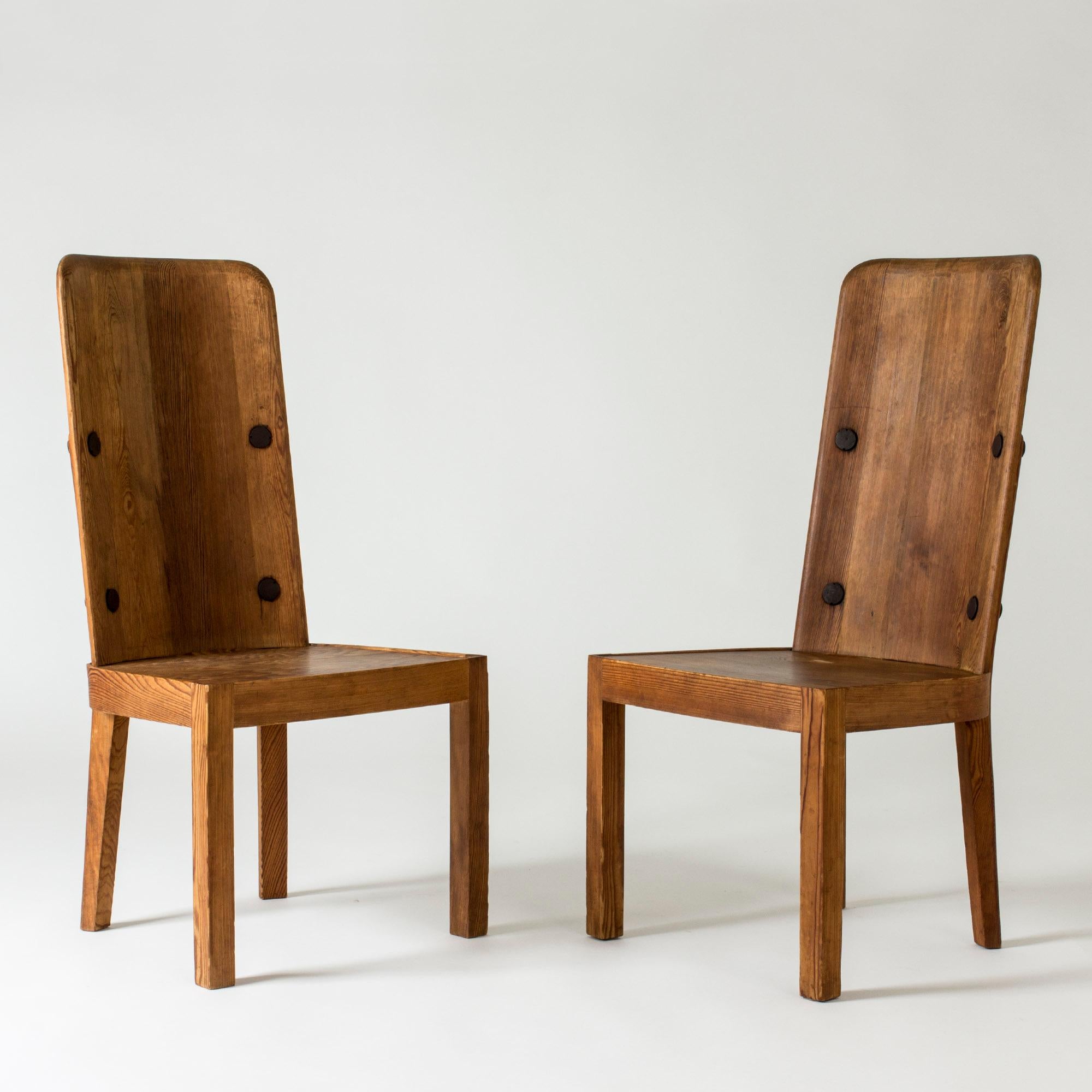 Pair of elegant “Lovö” dining chairs by Axel Einar Hjorth, made from pine. Beautiful design with clean lines and contrasting rustic wood.