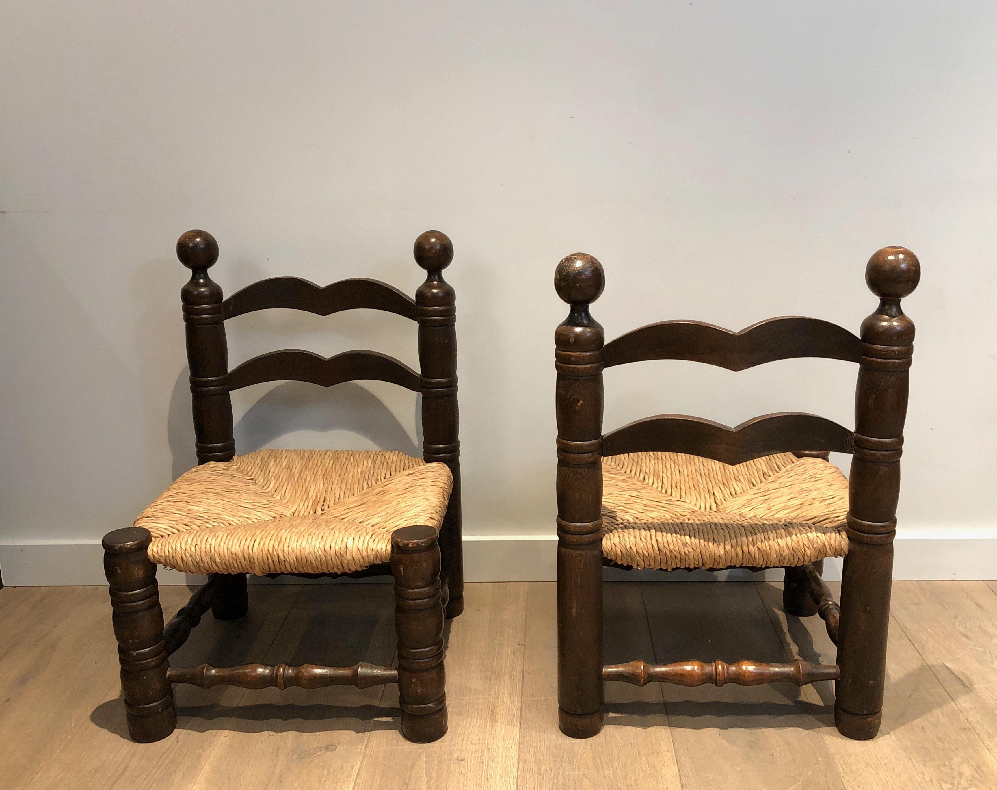 Early 20th Century Pair of Low Brutalist Chairs. French work by Charles Dudouyt. Circa 1920.