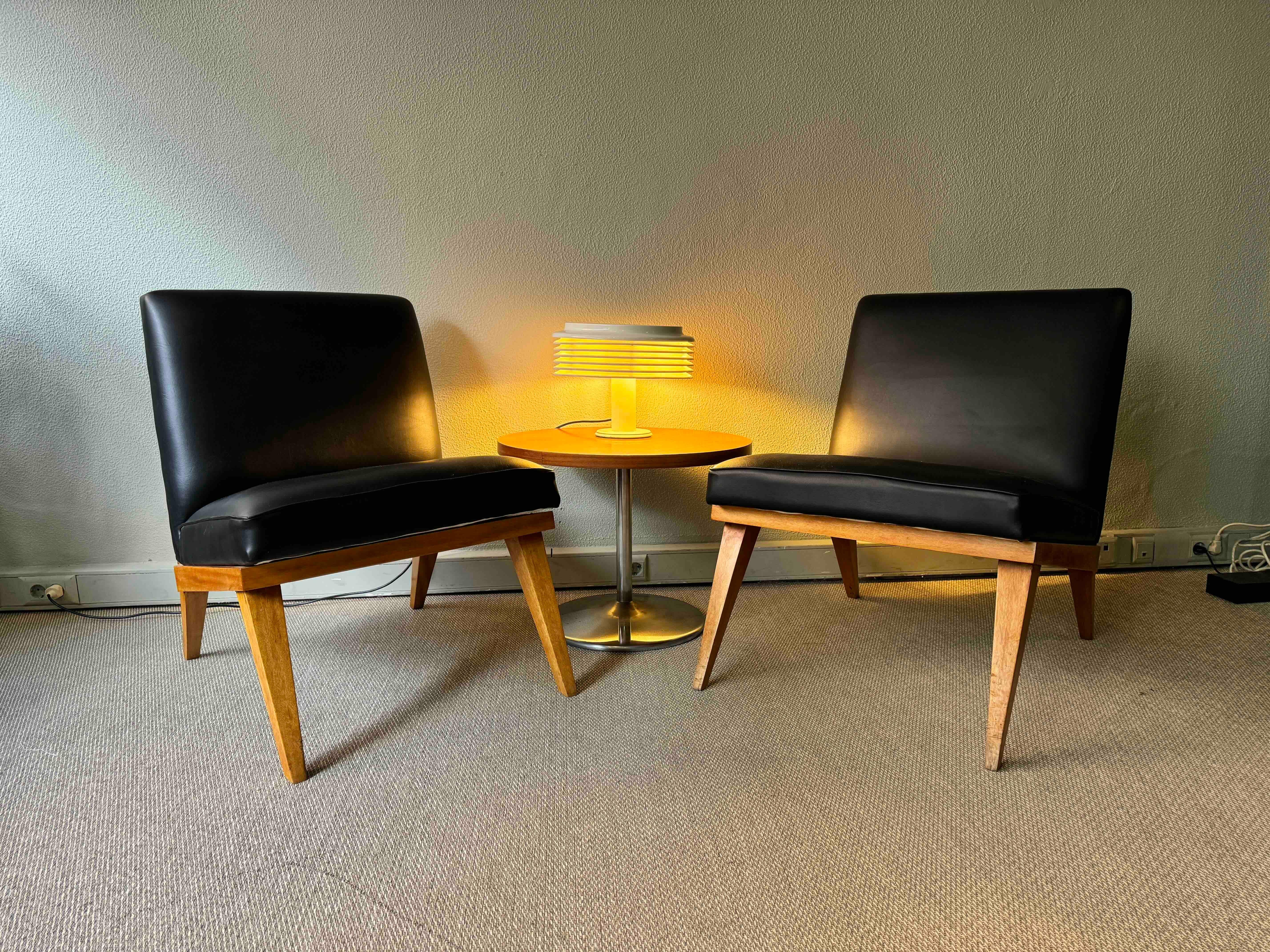 
Step into the timeless charm of mid-century design with this remarkable pair of low chairs, inspired by the iconic Jens Risom Slipper Chair style from the 1950s. What makes this pair unique is their individuality; one chair offers a slightly more