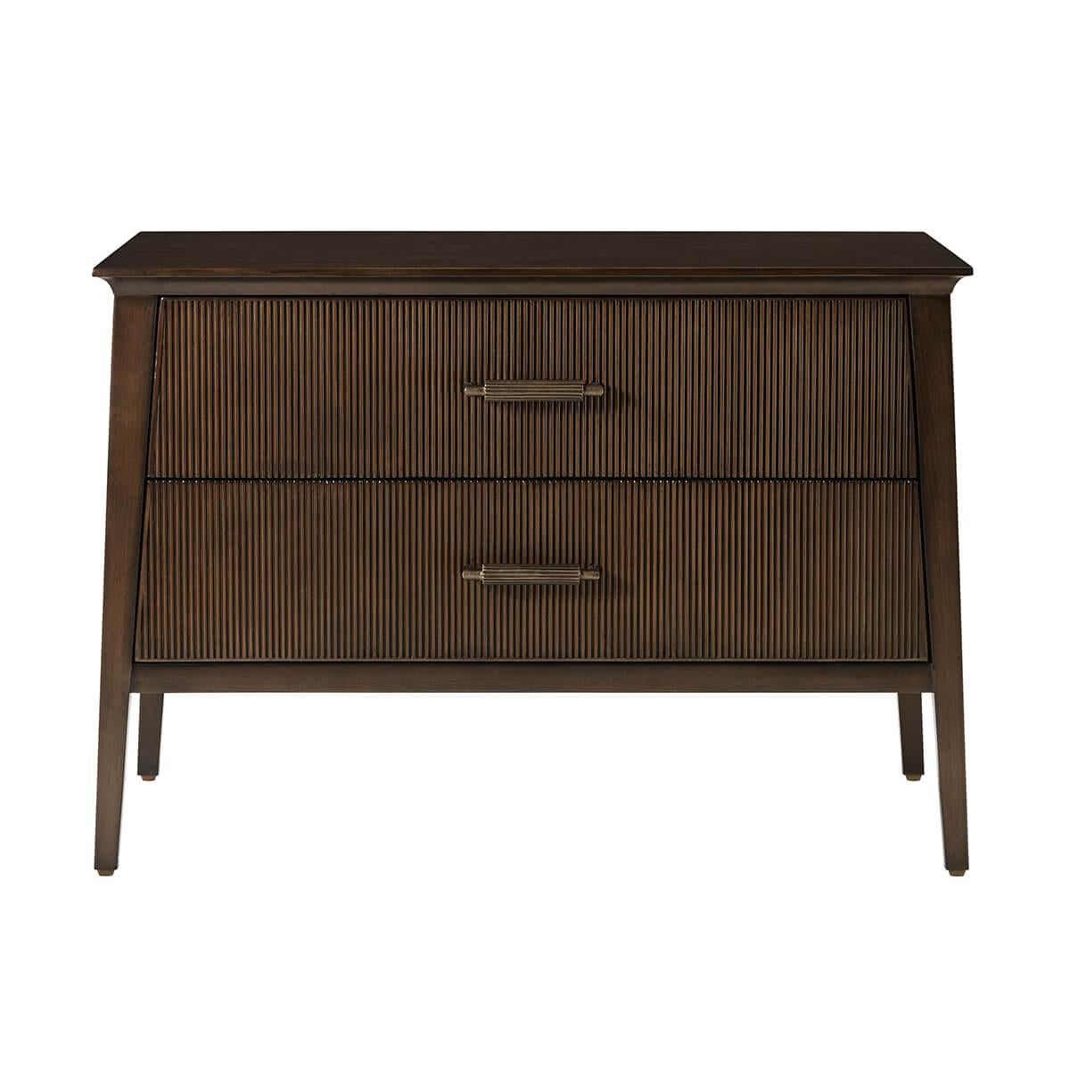 Crafted in dark Bistre finish, features a sophisticated tapered silhouette with three reeded drawers. The custom forged hardware, finished in a dark rubbed bronze, echoes the reeded details throughout.

Dimensions: 32