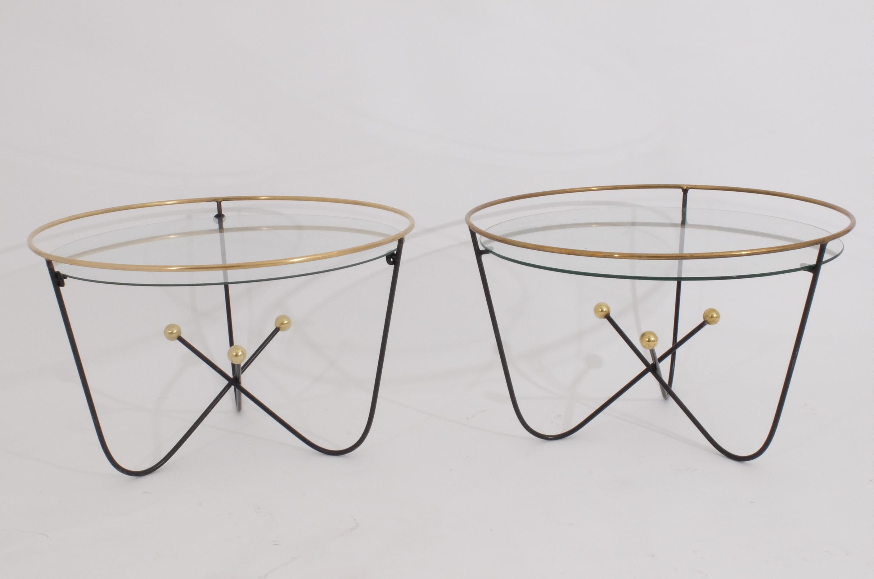 Edward Ihnatowicz for Mars Furniture and retailed by Heals London in the 1950s.
These little midcentury low table are typical of the 1951 festival of Britain style championed by British designers such as Ernest Race.
Painted metal and brass, glass