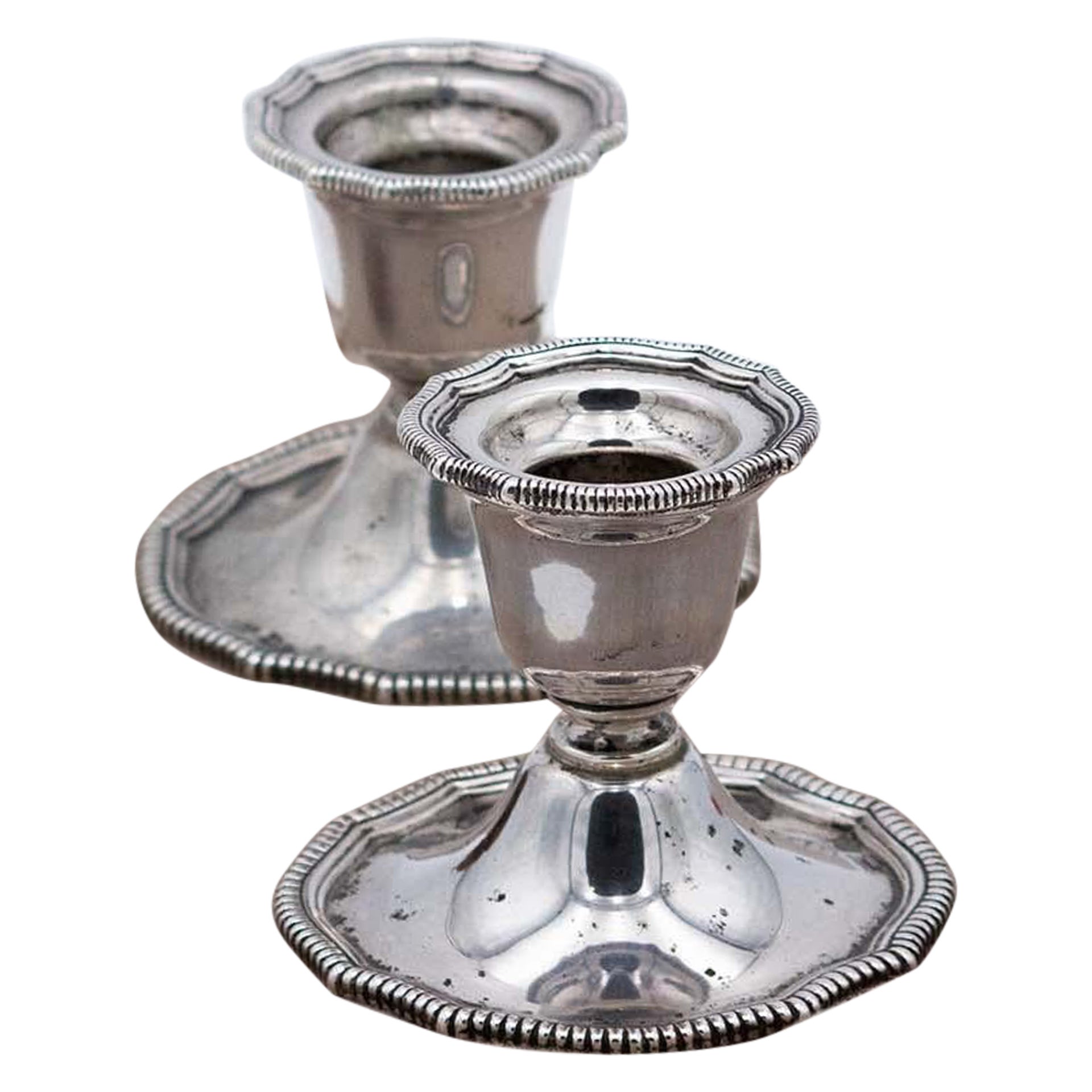 Pair of low silver candlesticks with pearlescent reliefs on the edges and bases For Sale