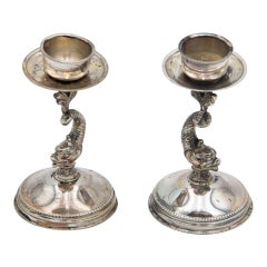 Pair of low silver fish-shaped candlesticks