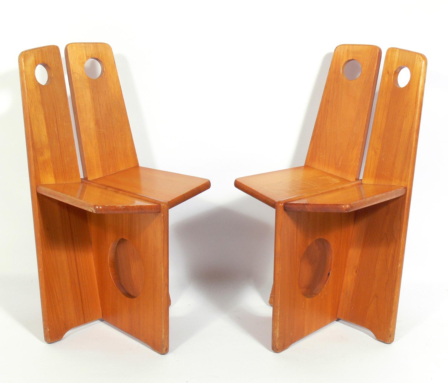 Pair of low slung constructivist chairs, German, circa 1950s. Design clearly influenced by Russian constructivism. Well worn, Industrial vibe with warm original patina. They are a low slung lounge size, and appear to be kid sized, but are actually