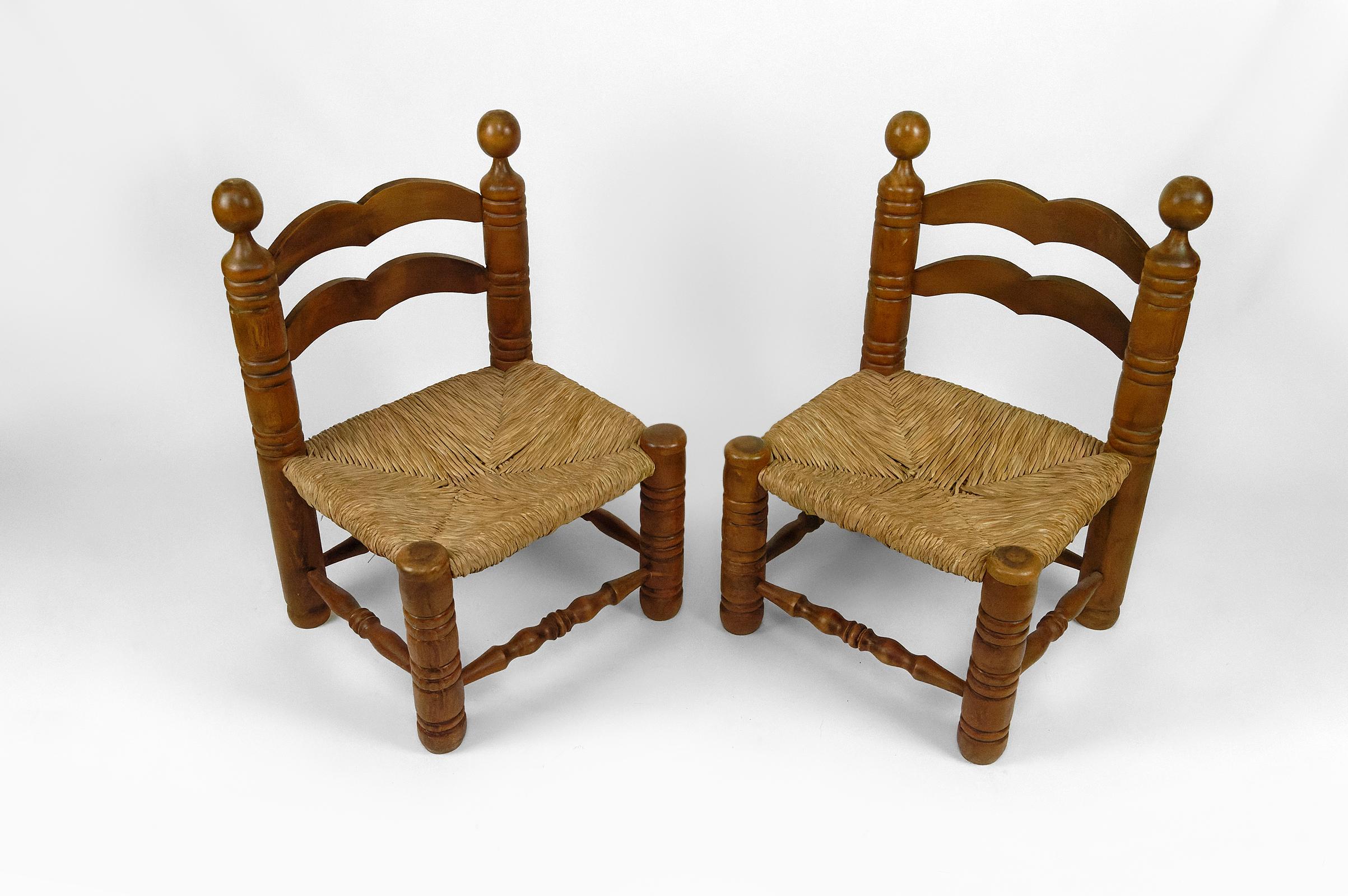 Pair of low straw chairs by Charles Dudouyt, France, circa 1940 For Sale 2
