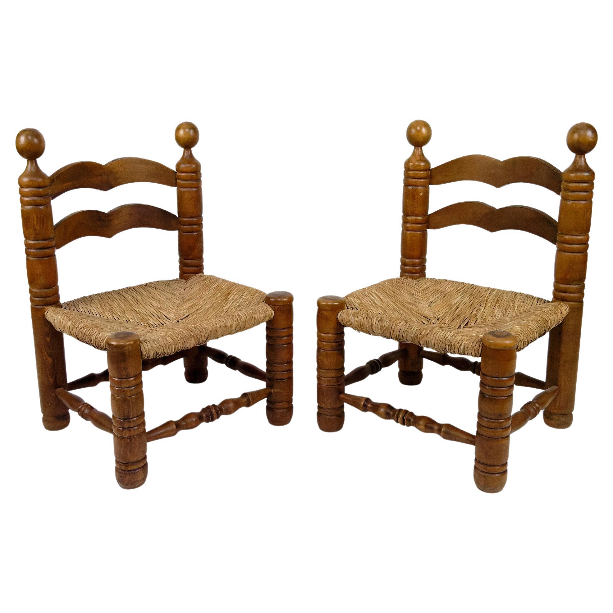 Pair of low straw chairs by Charles Dudouyt, France, circa 1940 For Sale