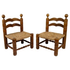 Pair of low straw chairs by Charles Dudouyt, France, circa 1940
