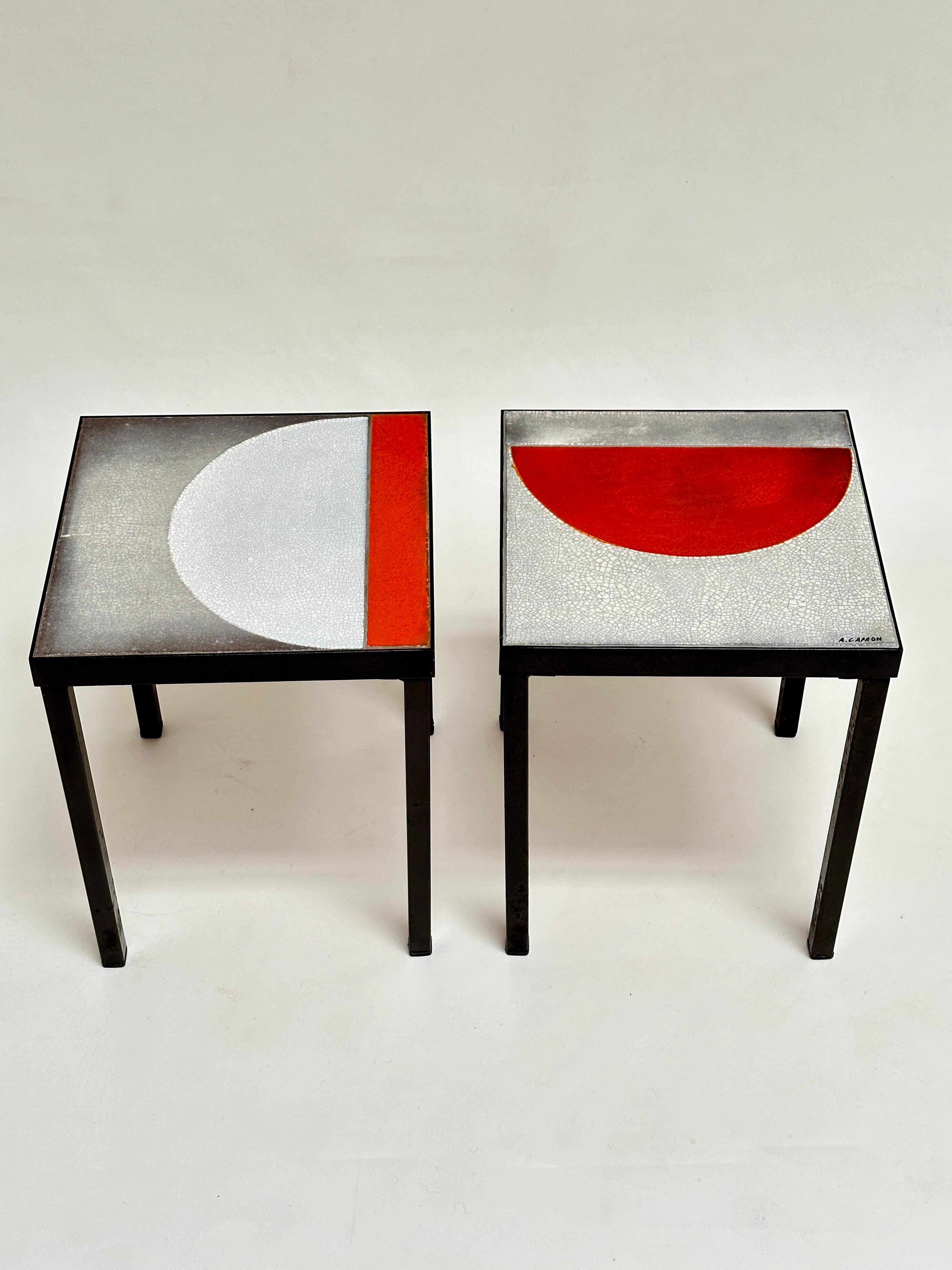 End tables made up of glazed lava top. 
Both structure and feet in black lacquered steel.
One table wears the Artist's signature.

Note that the feet are removable, which signs both an ingenious design and allows easy transport.
The table are in
