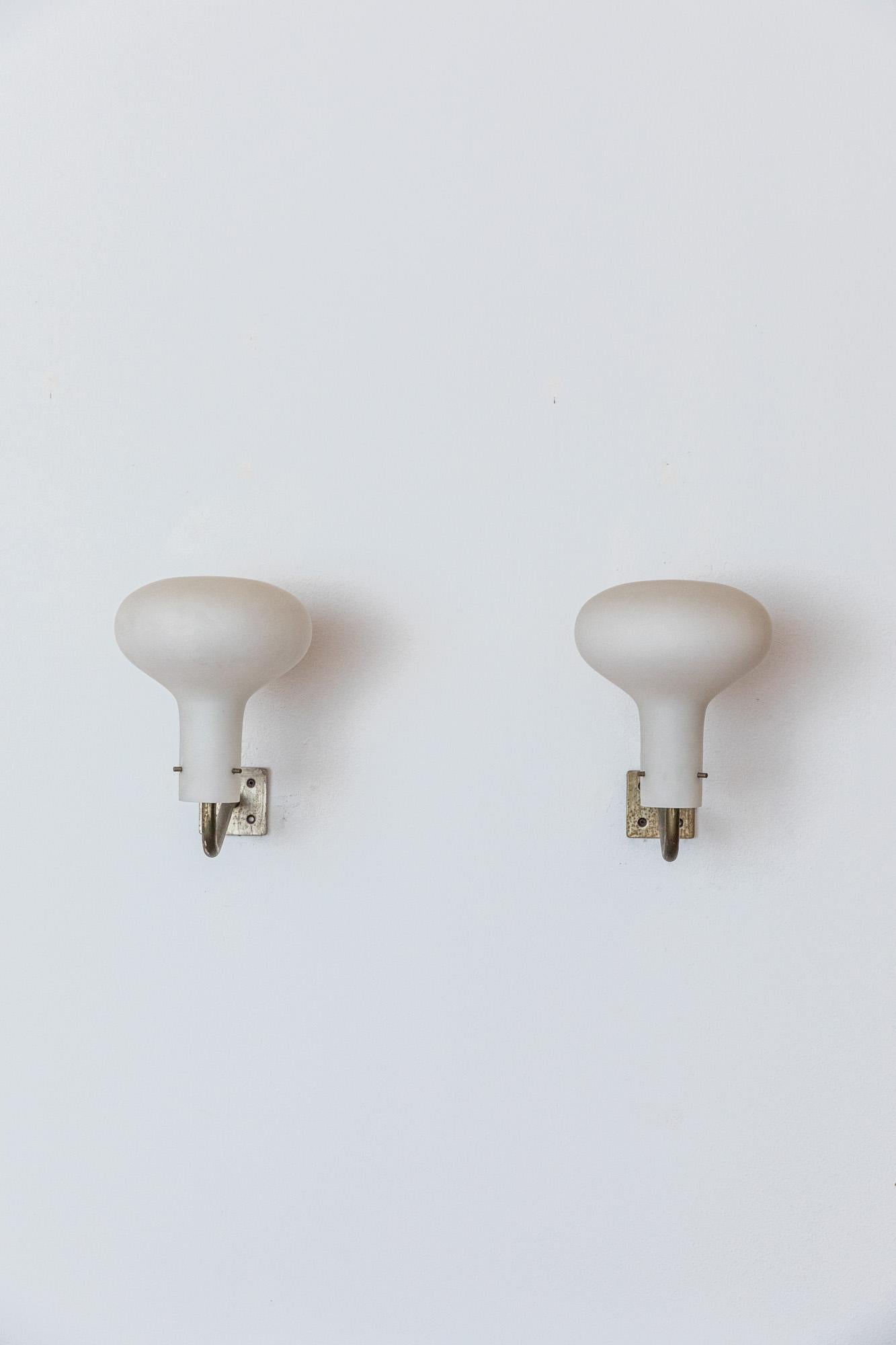 Iconic pair of LP12 wall lights designed by Ignazio Gardella for Azucena. 
Nickeled brass hardware with one large satin glass diffusers. 
Italy, 1950. 
Excellent vintage condition 