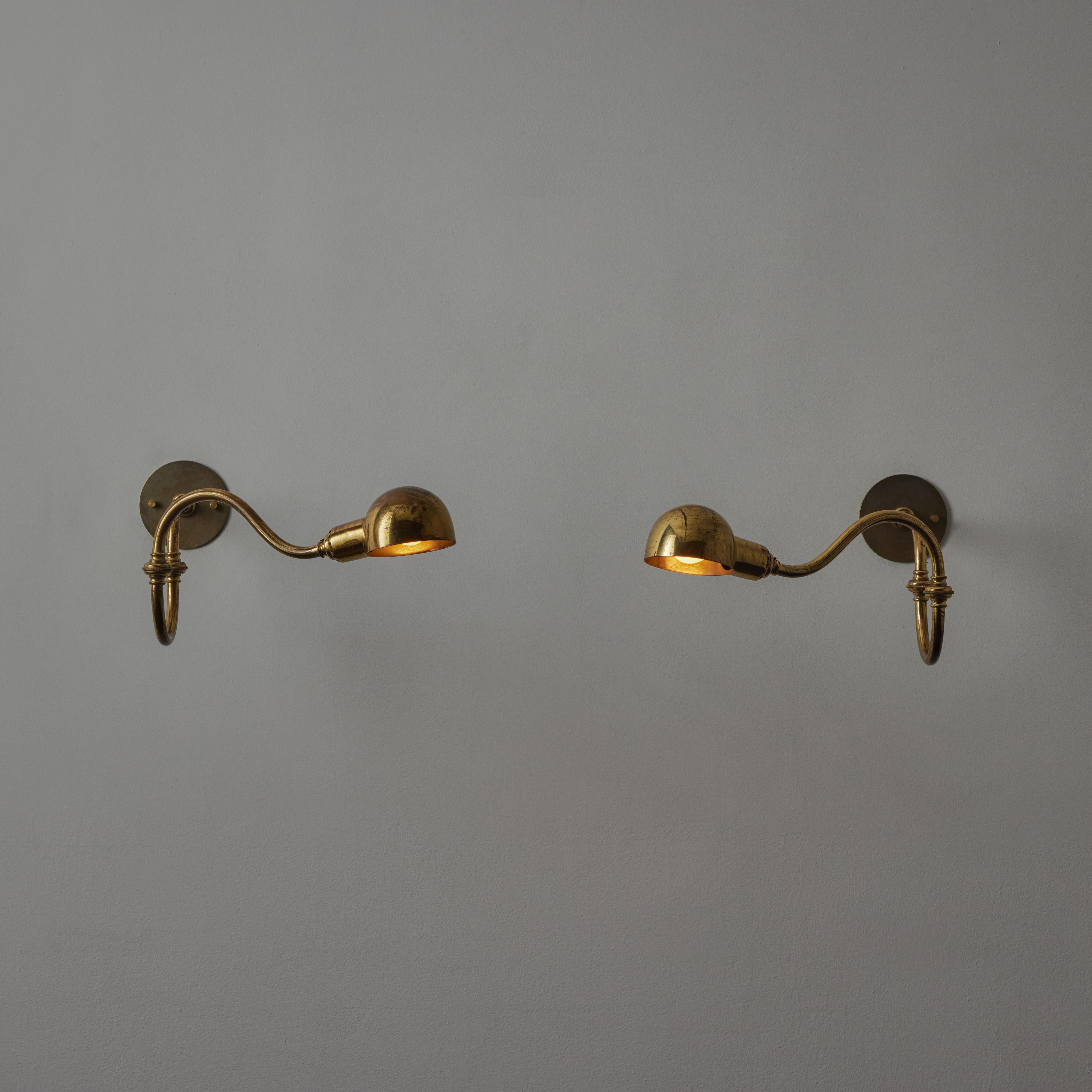 A pair of LP15 Tromba Sconces by Luigi Caccia Dominioni for Azucena. Designed and manufactured in Italy, circa 1950s. Arms and shade of light articulate to various positions. The Interior of shades are enameled. Wired for US. We recommend one E14