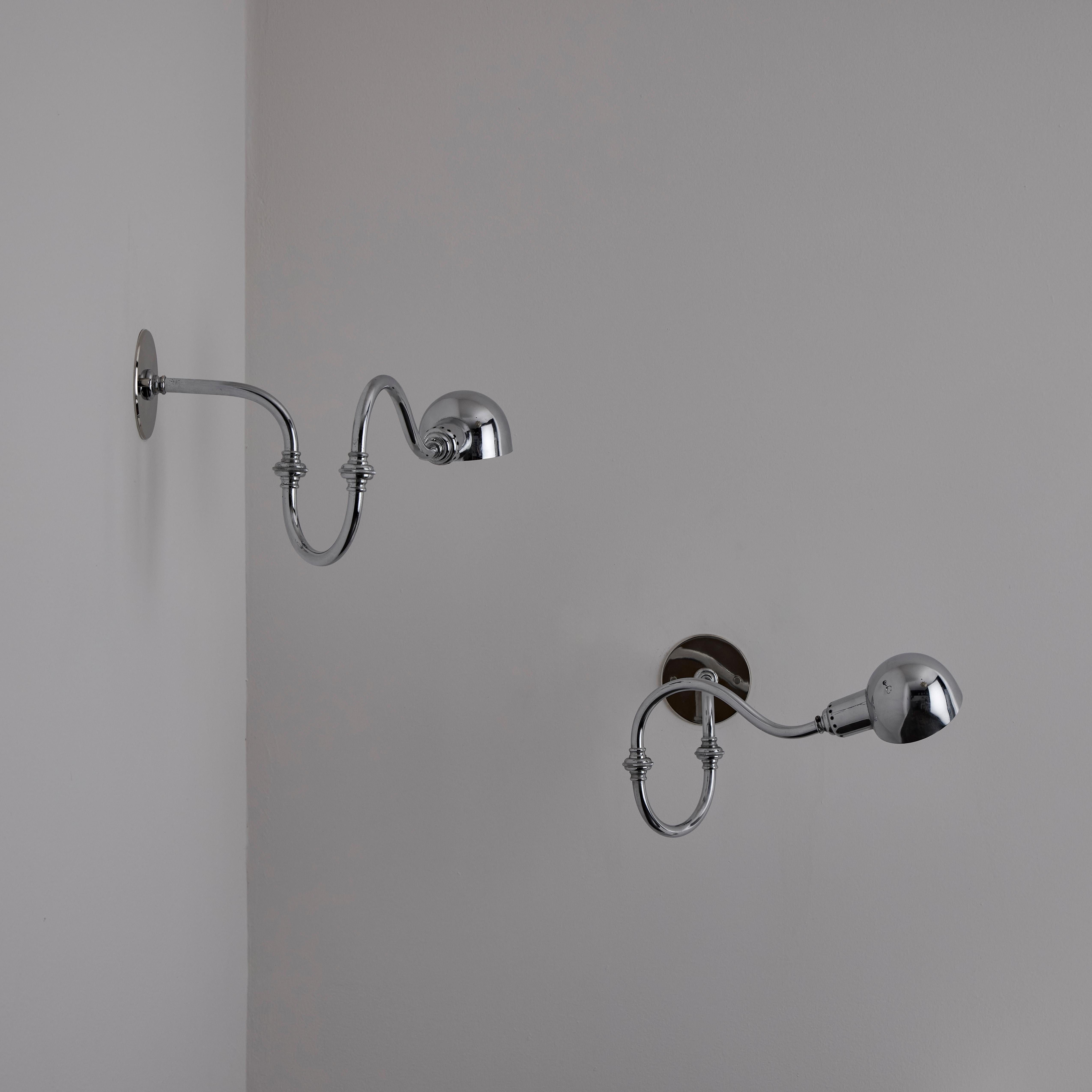 A pair of LP15 Tromba Sconces by Luigi Caccia Dominioni for Azucena. Designed and manufactured in Italy, circa 1950s. Chrome. Arms and shade of light articulate to various positions. Wired for US. We recommend one E14 base 75w maximum bulb per