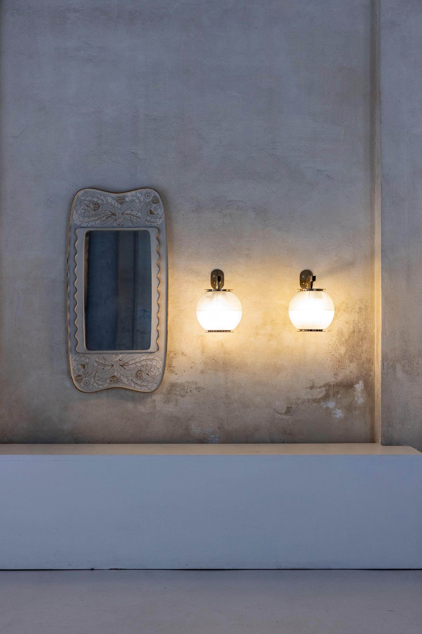 Pair of LP7 wall lamps designed by Ignazio Gardella for Azucena. These iconic and elegant lamps feature molded glass diffusers gracefully suspended on adjustable brass arms, combining timeless design with functional sophistication.
Italy, 1955
