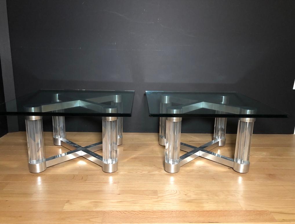 Pair of modern/contemporary silver tone custom Lucite, aluminum and glass cocktail/coffee tables. Thick Lucite rods grouped to form four legs. Cross stretchers at top and bottom of machined aluminum.