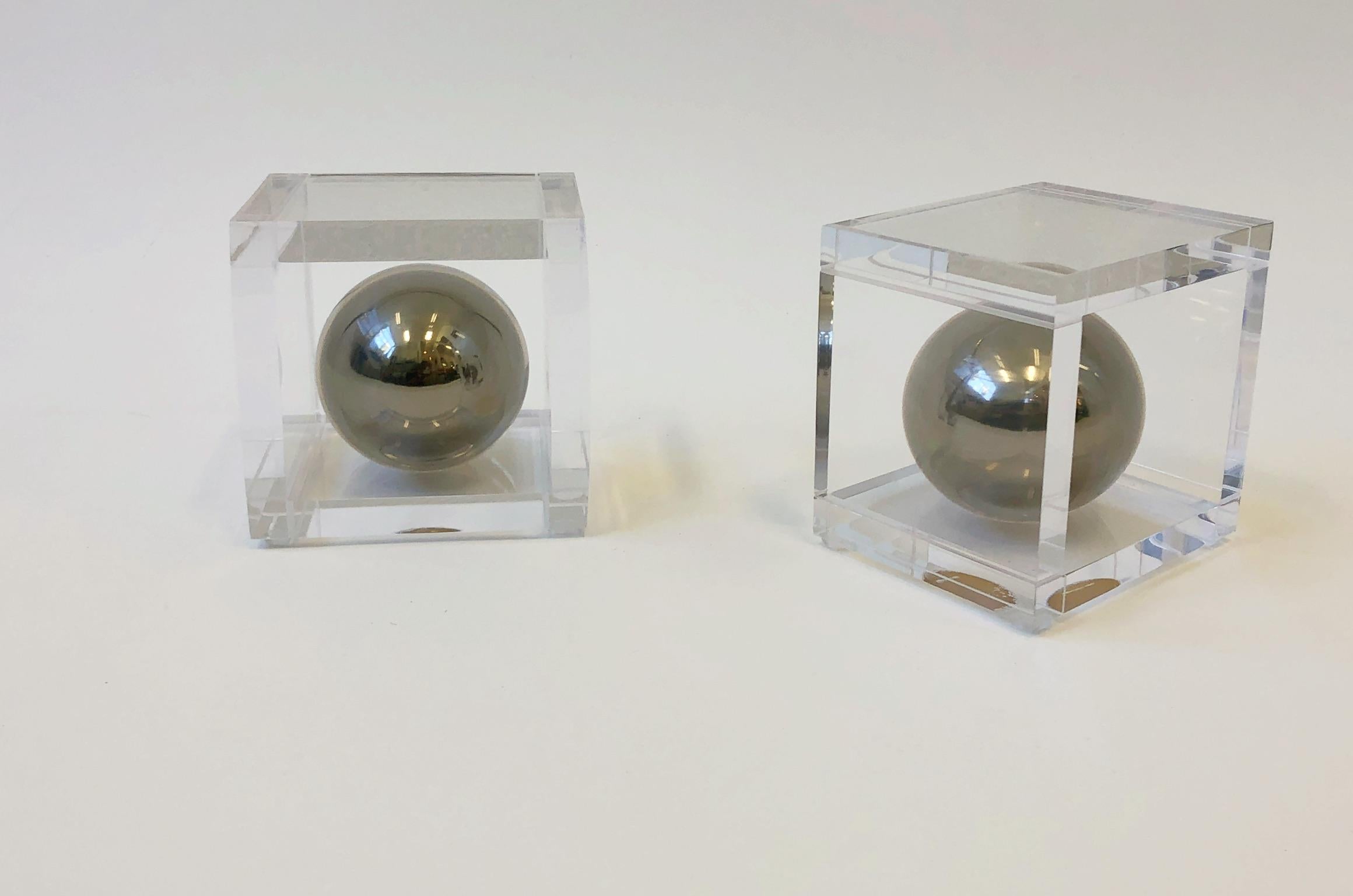 A glamorous pair of clear Lucite and polish chrome bookends by renowned American designer Charles Hollis Jones. This are part of the “Ball Line” originally design in the 1970s
The chrome sphere is covered by clear acrylic. 

Dimensions each: 6”