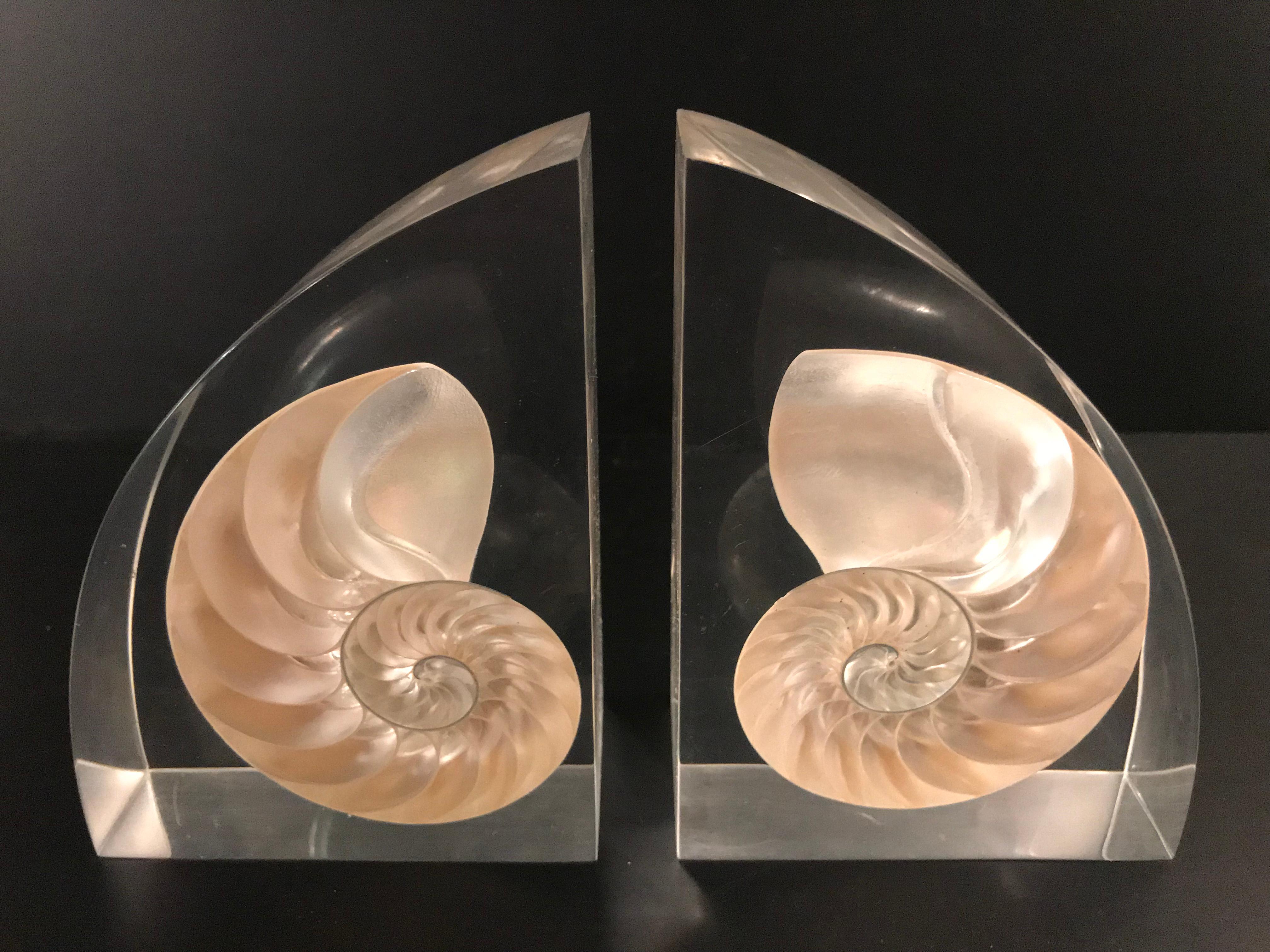 Pair of Lucite bookends with encased nautilus shell.