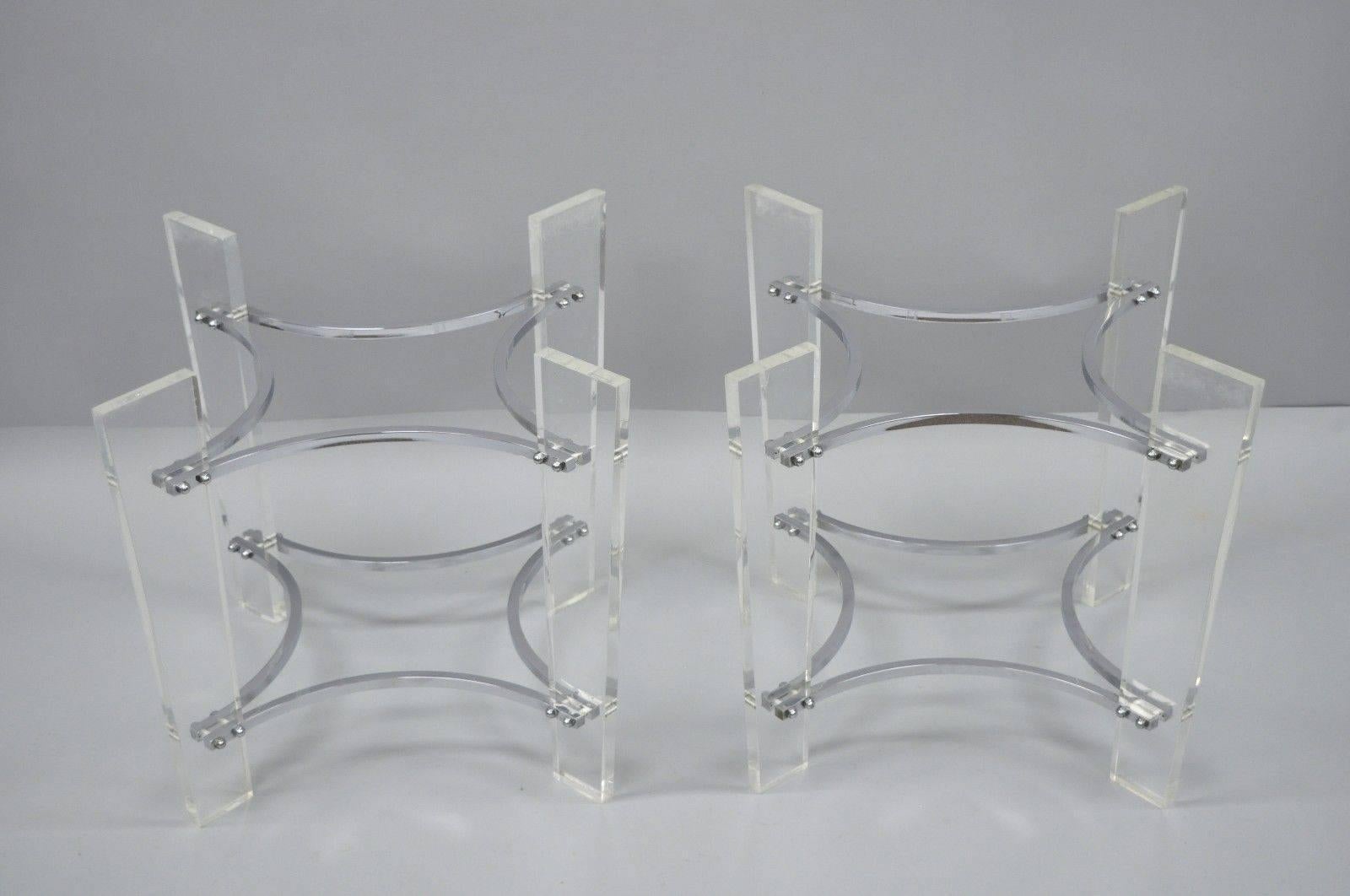 Pair of vintage Lucite and chrome sculptural Mid-Century Modern end table bases (No Tops). Item features angled Lucite legs, chrome star form supports, sleek sculptural style, bases only, no tops. Age, circa 1960s. Measurements: 20