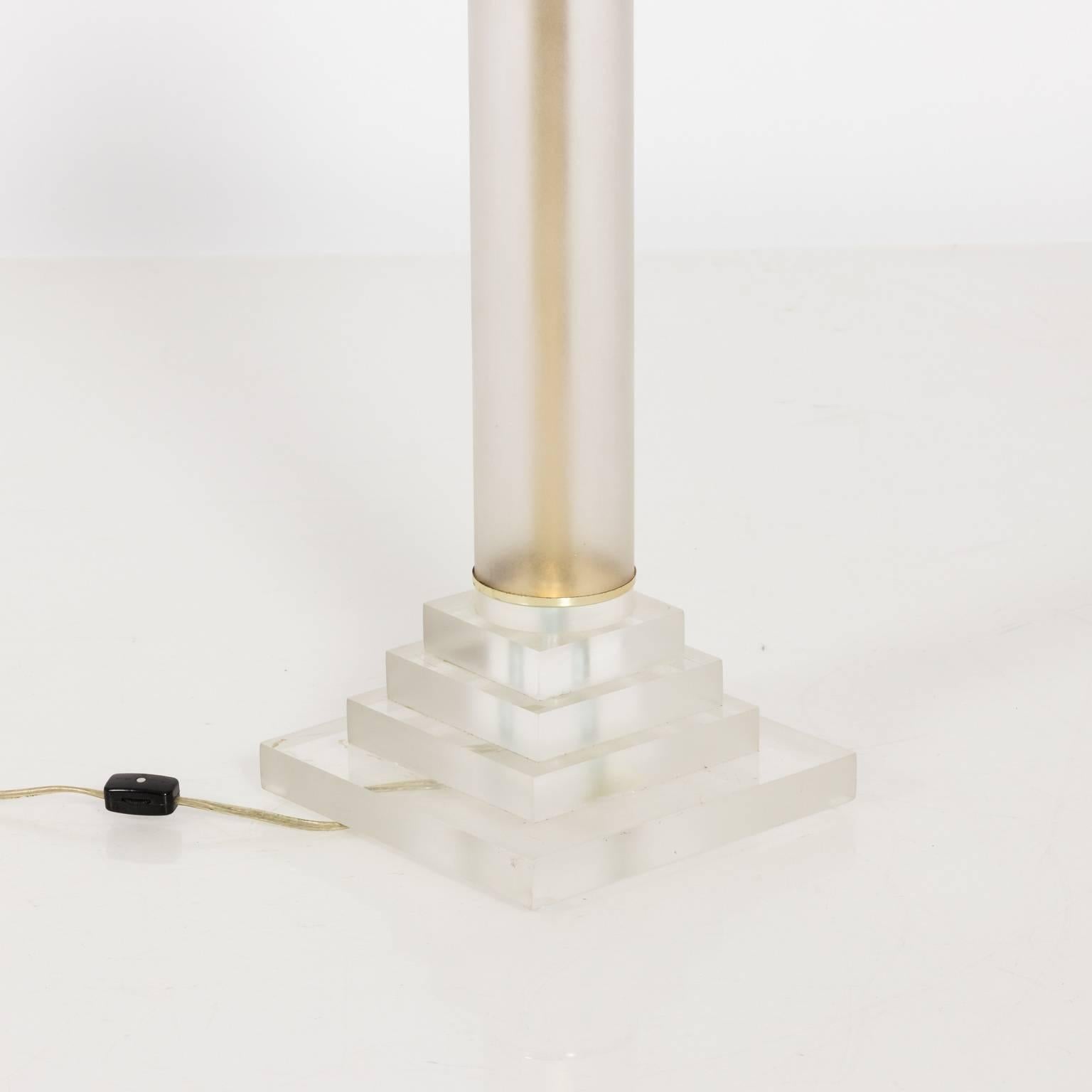Pair of Lucite column lamps on square Lucite bases, circa 1970s. The Lucite on the columns has slight signs of discoloration.
 