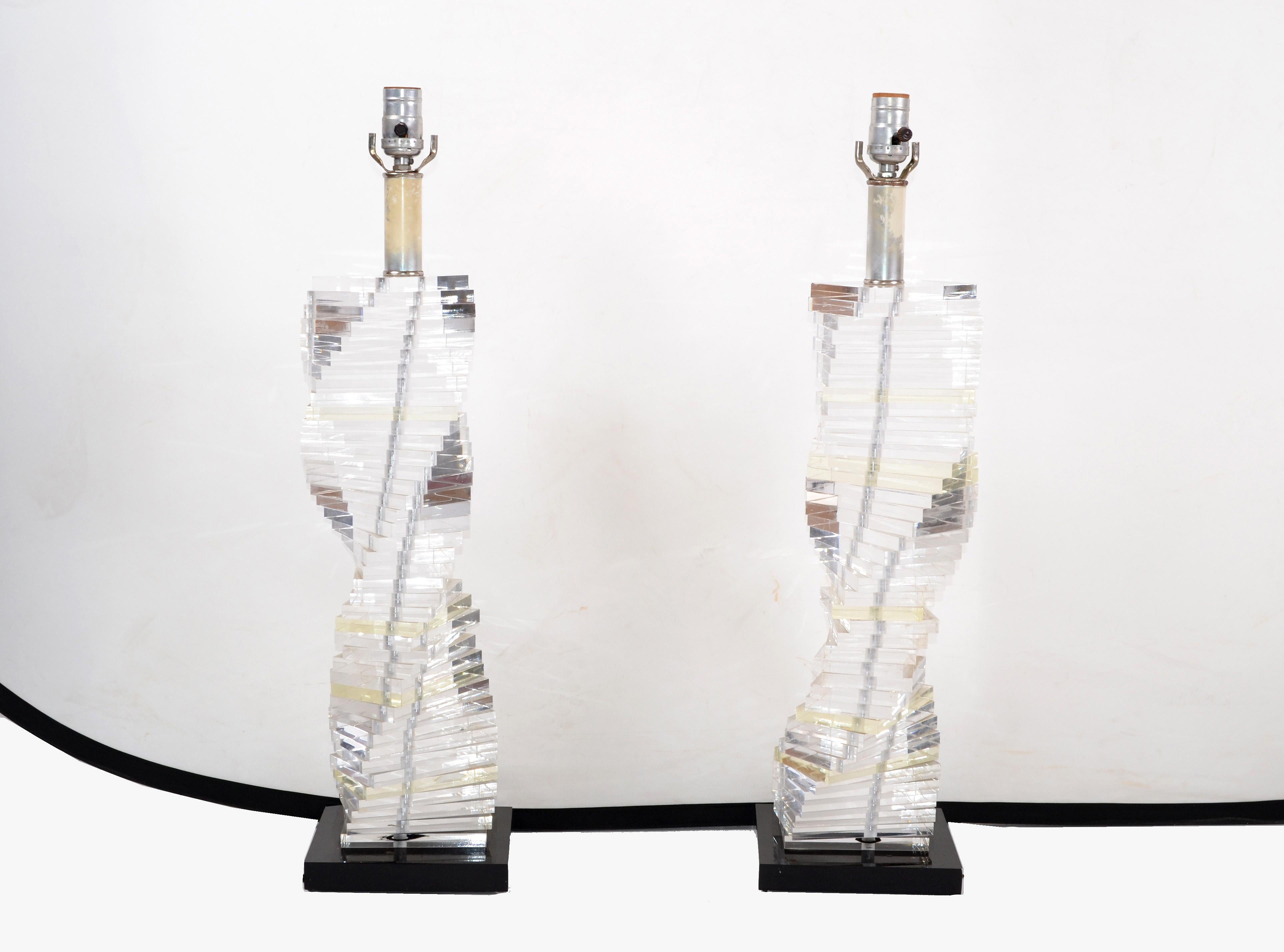 Superb pair of Lucite lamps, black Lucite base and spriral stacked staircase design of clear Lucite.
US wired and each takes one regular or LED light bulb.
No Shade, Harp or Finial.