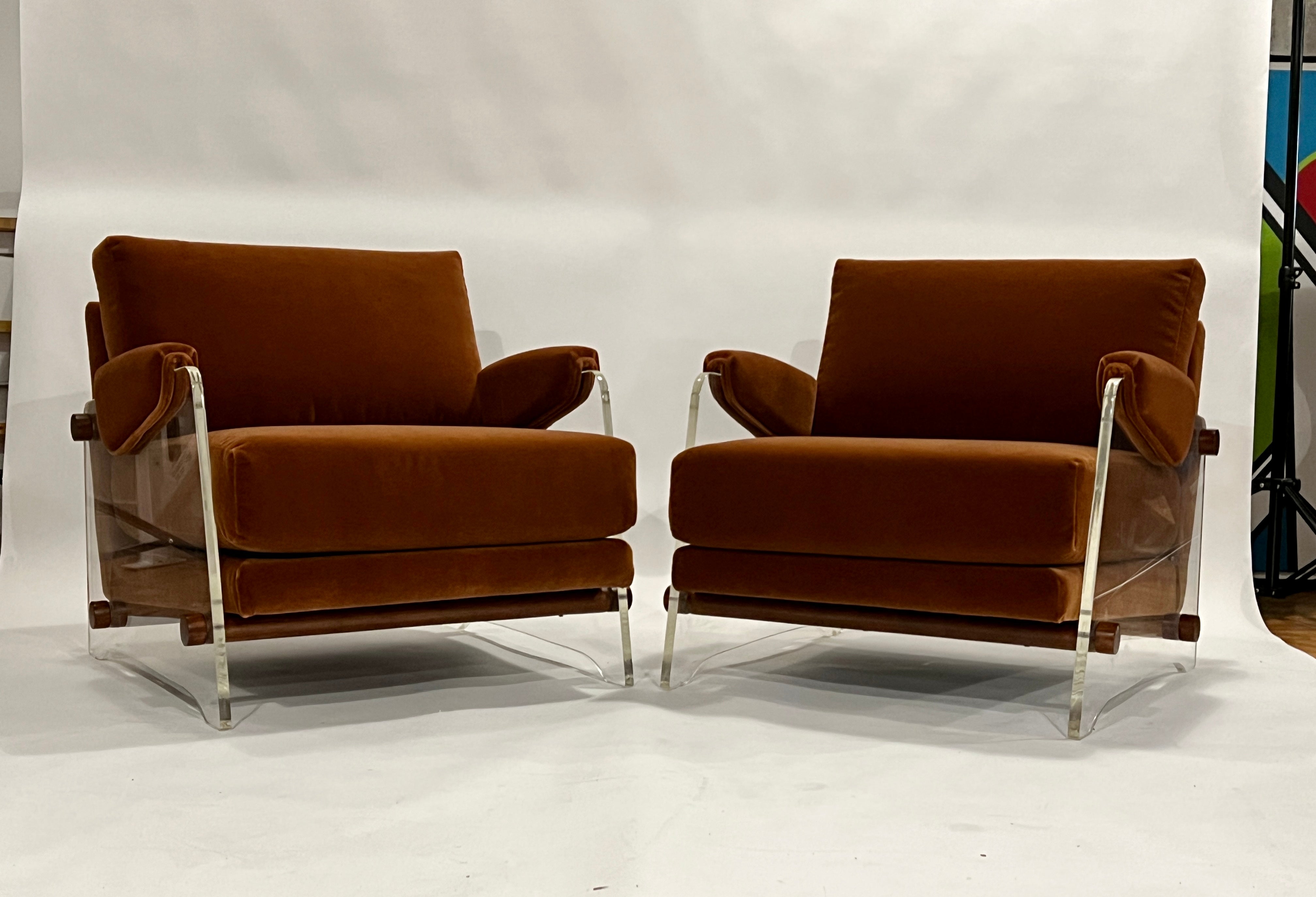 Pair of vintage lucite lounge chairs fully reupholstered in a rust color mohair and refinished walnut wood rod supports. These magnificent and rare chairs are in the style of Milo Baughman and Pace collection. They are also very similar to a rare