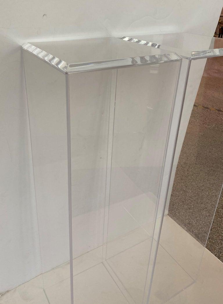This pair of lucite pedestals are a custom fabrication by Iconic Snob Galeries.

Note: Top surface area measures 11.25