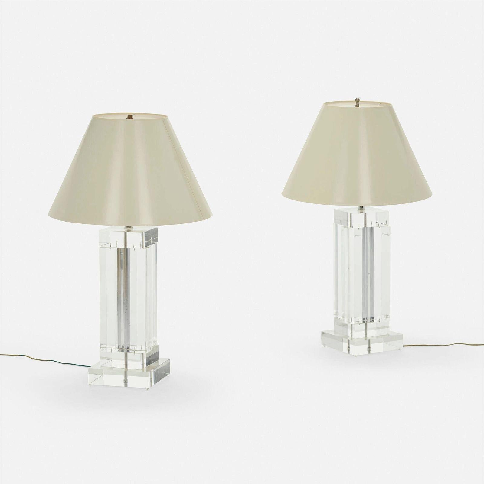 Elevate your home decor with this exquisite Pair of Lucite Table Lamps attributed to 