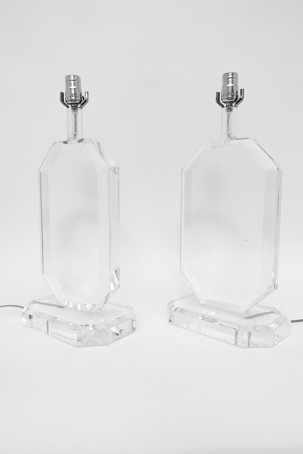 A pair of stunning and stylized Lucite table lamps in the style of Les Prismatiques acquired from a Palm Beach estate.