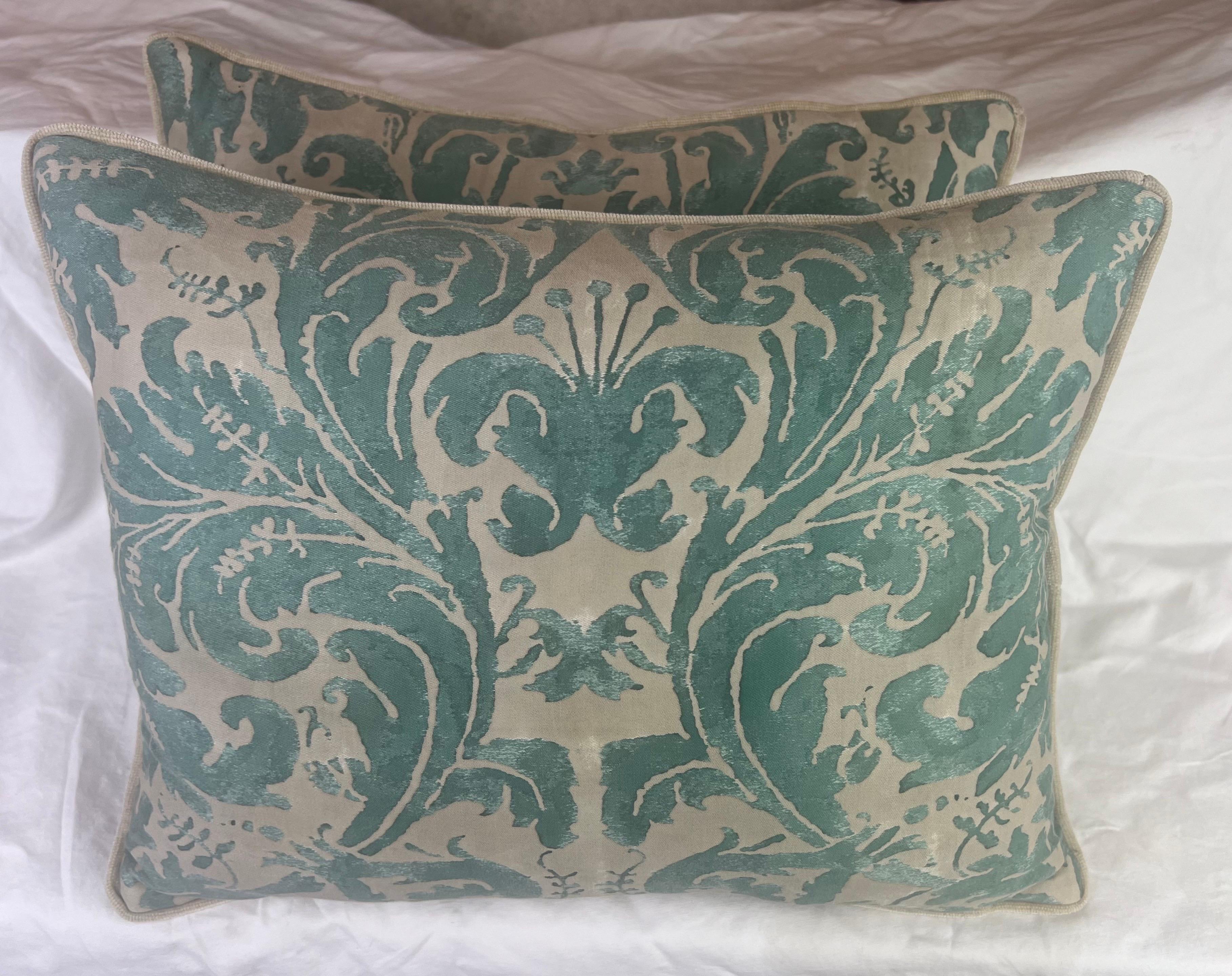 Pair of custom green & beige Fortuny Lucrezia patterned pillows with velvet backs.  The seventeenth-century Italian design, paying homage to an ancient noblewoman, adds a rich historical and cultural dimension to the pillows.  The large plumes and