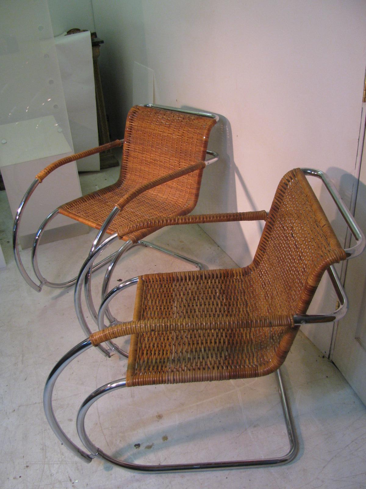 Iconic design by Ludwig Mies van der Rohe from the mid twenties. Great pair of chairs from the sixties with quality components. Small seat portions and top edge of one chair have been rewoven using the same wicker material, however the color is a