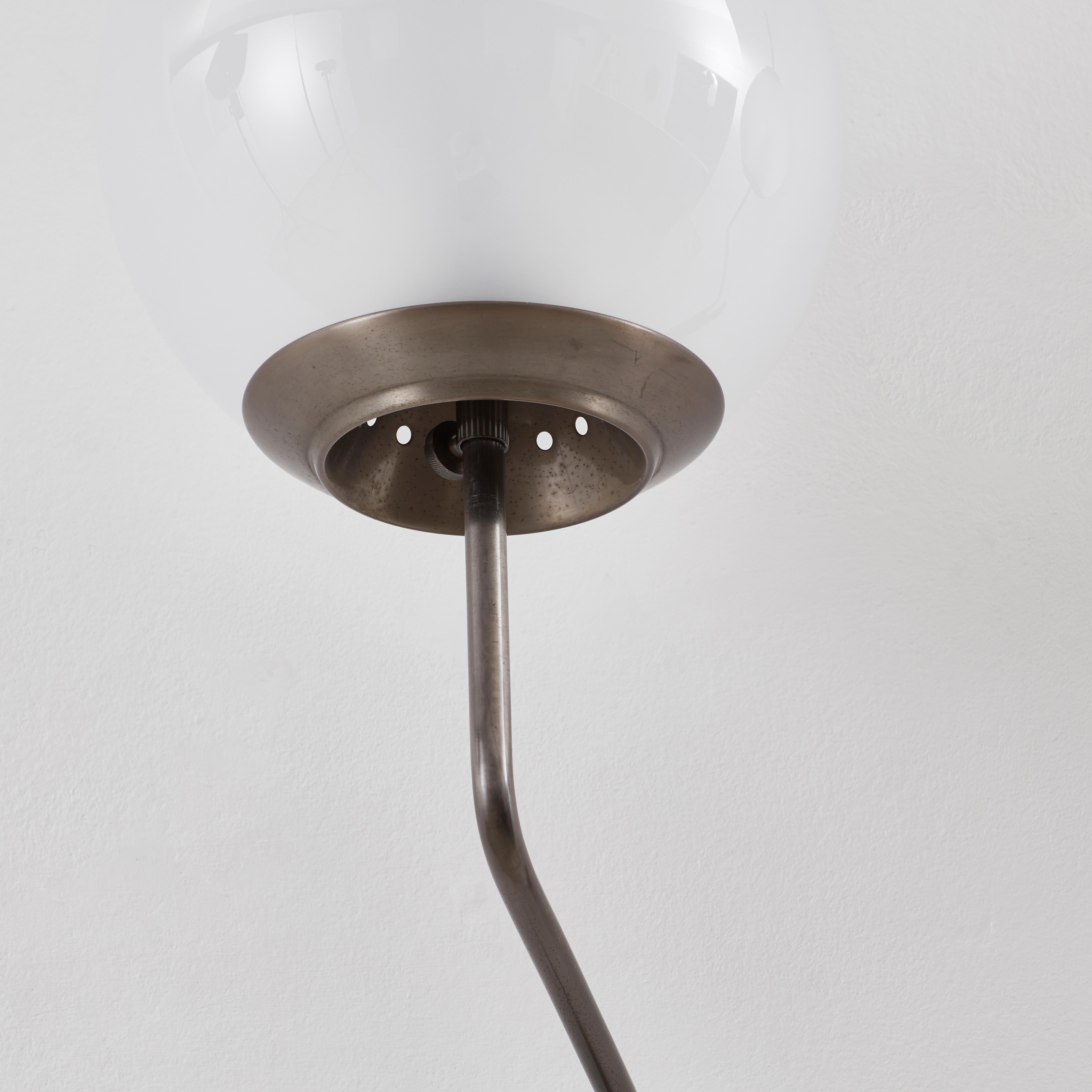 A pair of LP11 Pallone wall lights by Milanese architect and designer Luigi Caccia Dominioni (b.1913–2016). A frontrunner of industrial design, Dominioni is known for his major contribution to mid-century Italian design, where some of his designs