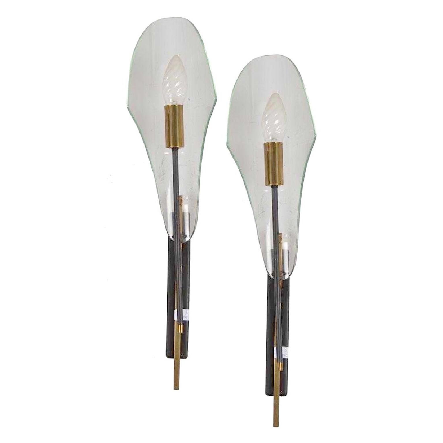 Pair of 1950s Italian sconces by Luigi Molin. Single brass light on a black enameled slender stem within a bent glass reflector. Rewired and ready to install. See our separate listing LU886613946892 for the matching 3-light chandelier.