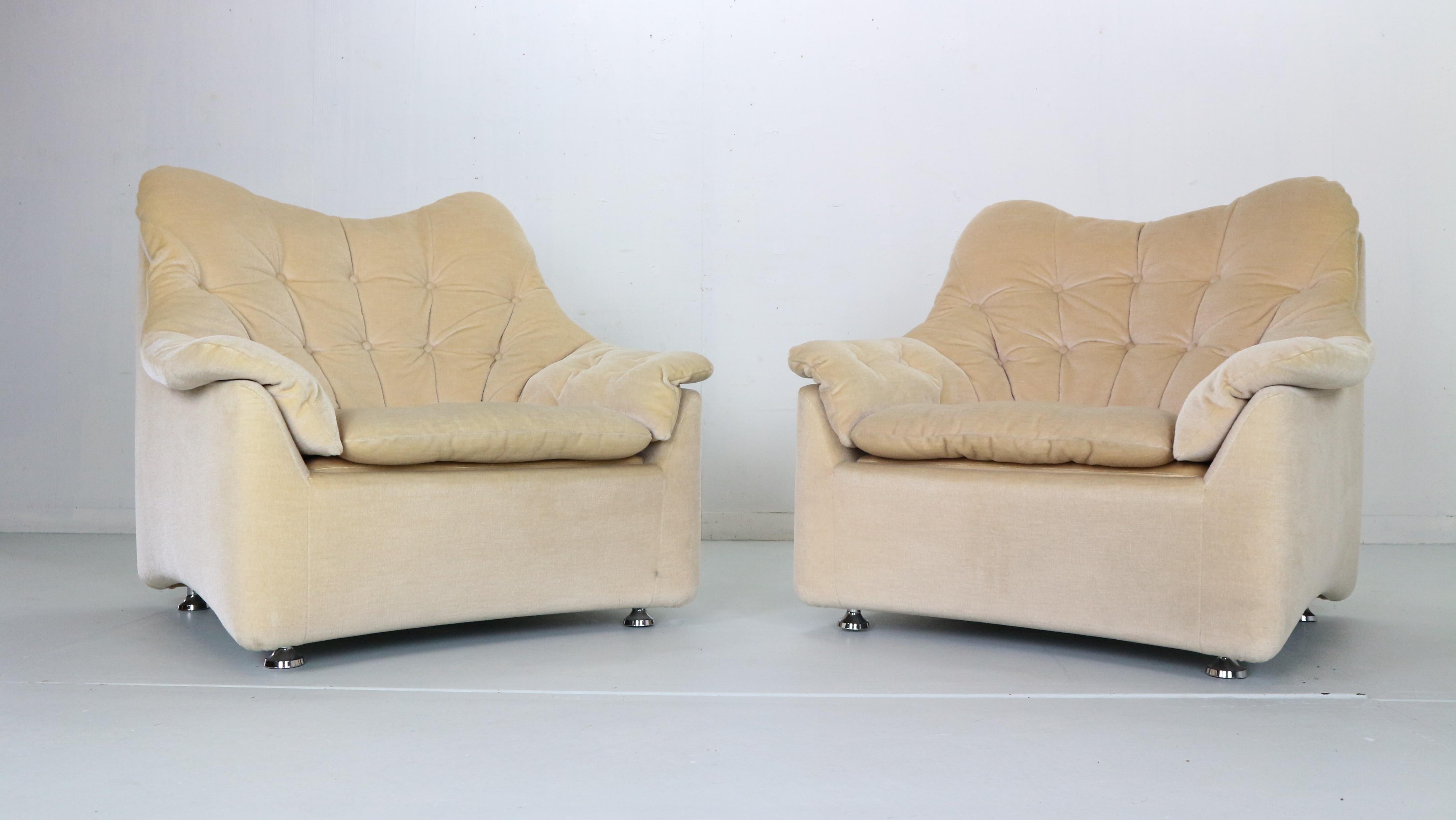 Set of two lounge chairs made in 1950's period, Germany. The chairs are made of mohair fabric. Off white into beige tone colour. A little rounded with high back rests and white seating chairs are very soft and comfortable. In very good condition.