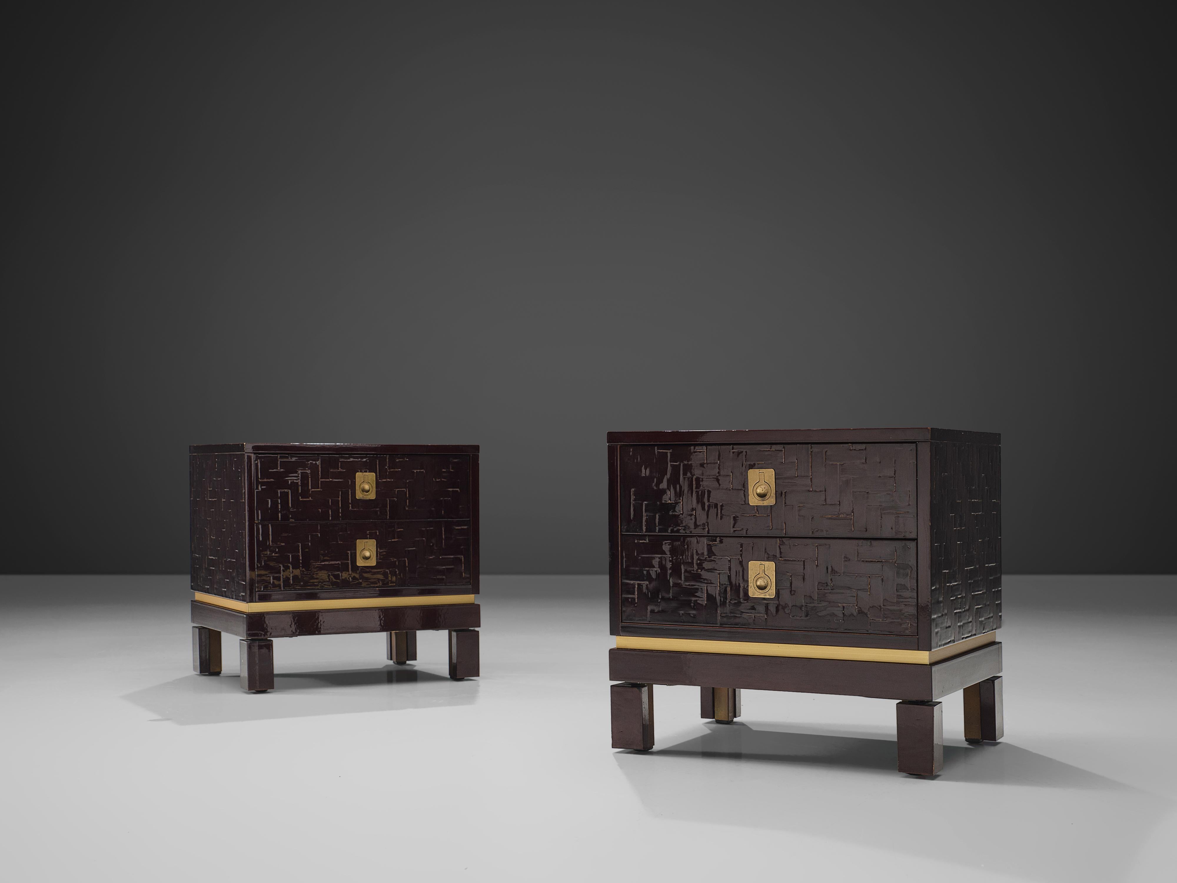 Pair of nightstands, lacquered wood, brass, Europe, 1960s.

These two lovely dark brown nightstands convince the viewer with their textured surface in combination with brass details. The cubic shape is structured with two drawers. With their dark