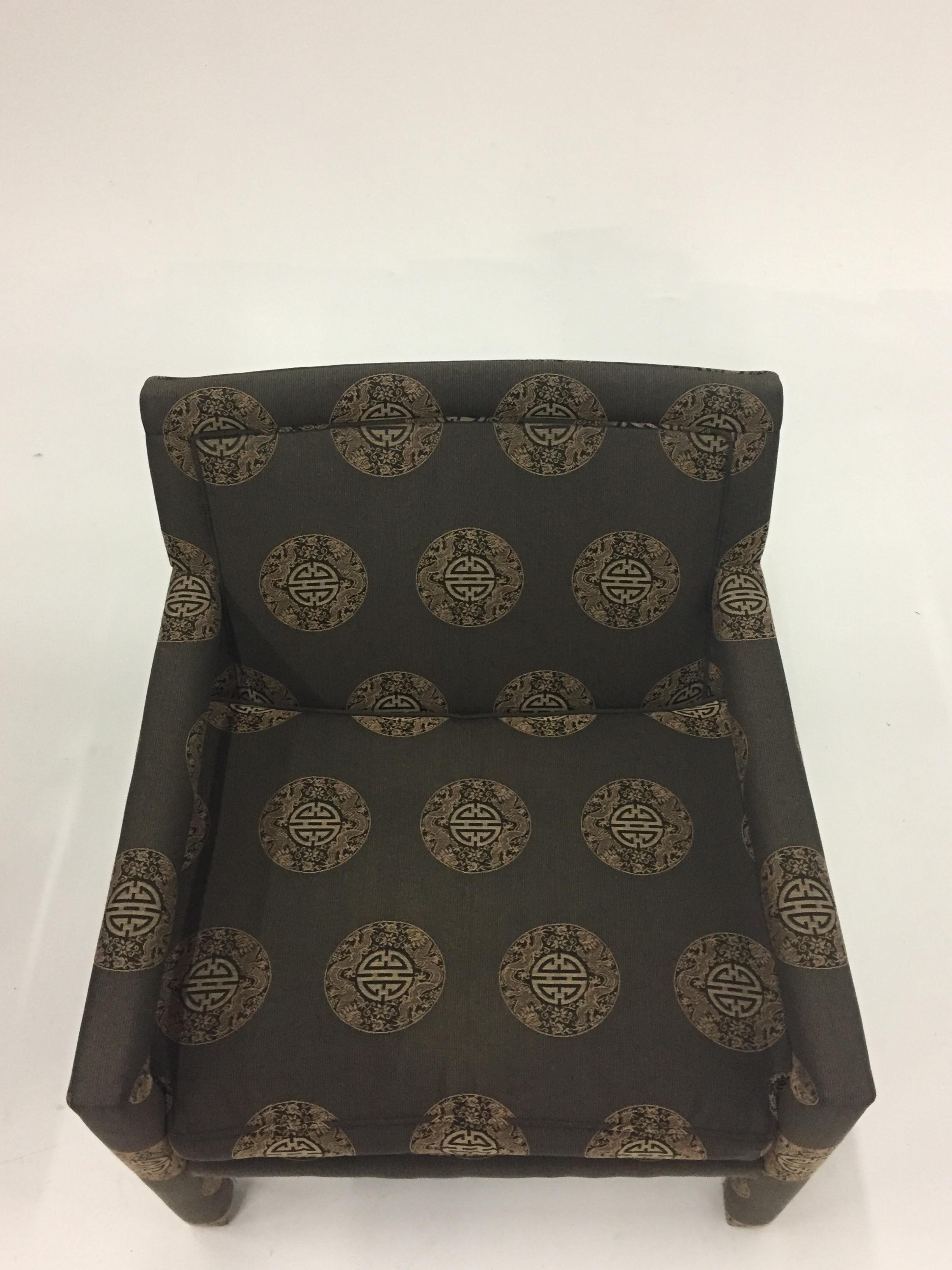 Sophisticated pair of upholstered club chairs attributed to Milo Baughman having
an Asian circular geometric pattern. The arms and legs are also seamlessly upholstered to give a sleek contemporary look.
Chairs are circa 1970, upholstery is much