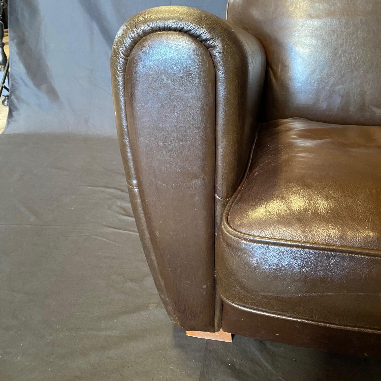 Pair of luxurious vintage leather club chairs with round backs bought in Avignon, France. Super solid and comfortable and in great shape with some minor damage to the seats as seen in photos.
arm height 22
