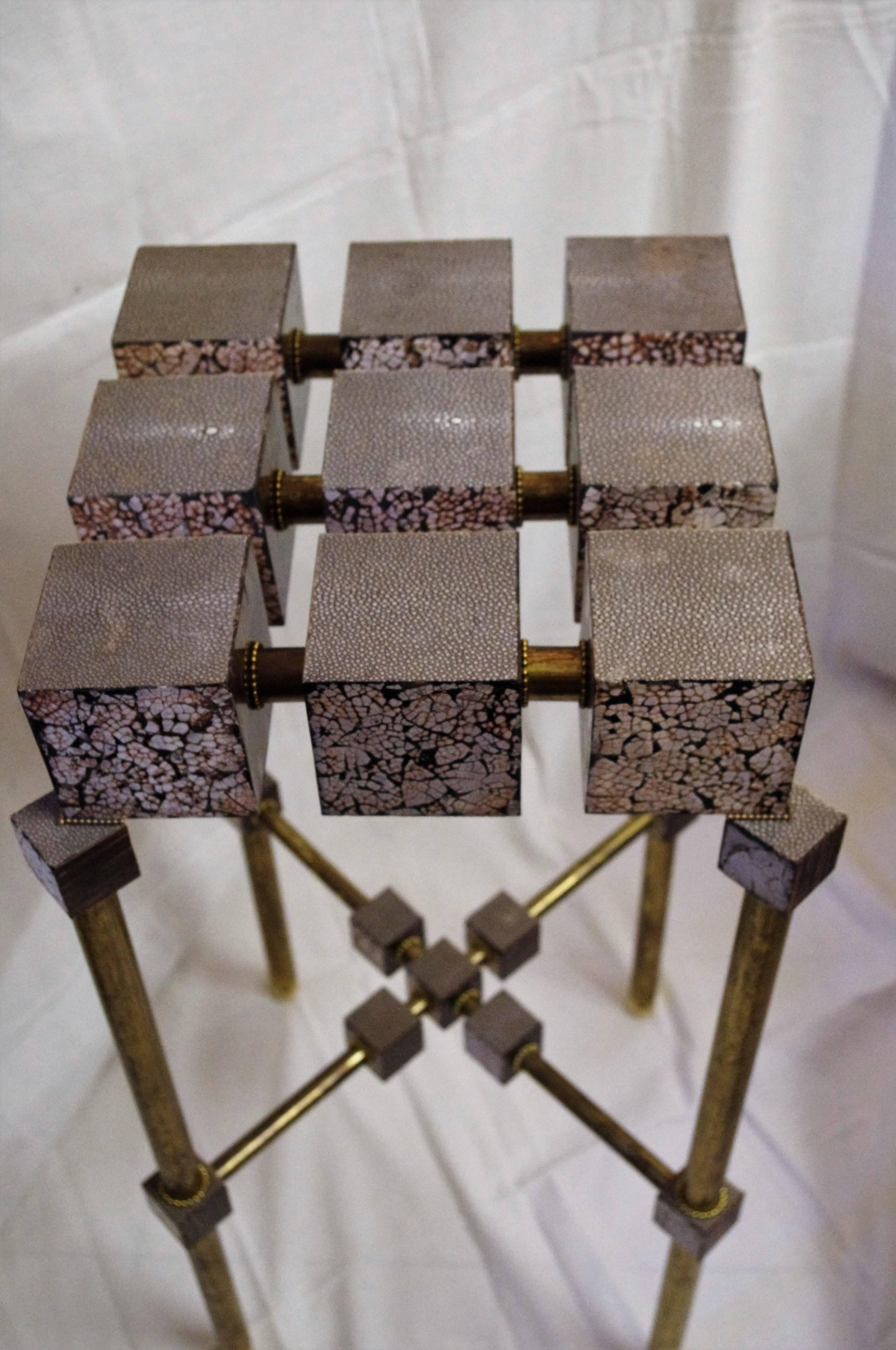 Luxury and unique creation of two high side tables or pedestals entirely handmade in France only with extremely noble luxury materials.
Made in fabulous shagreen galuchat, Macassar ebony, palisander from Rio, eggshell mosaic, parchment and red