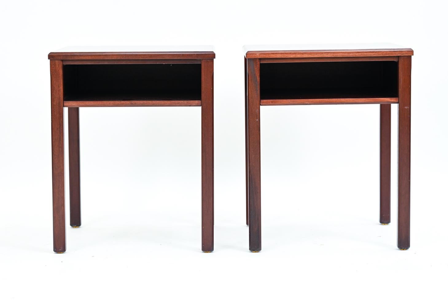 A pair of Danish mid-century nightstands or end tables featuring single open shelf and single fluted edge to legs. These traditional-style tables, c. 1950's, are in quality mahogany.

With Lysberg, Hansen, & Terp label underneath.