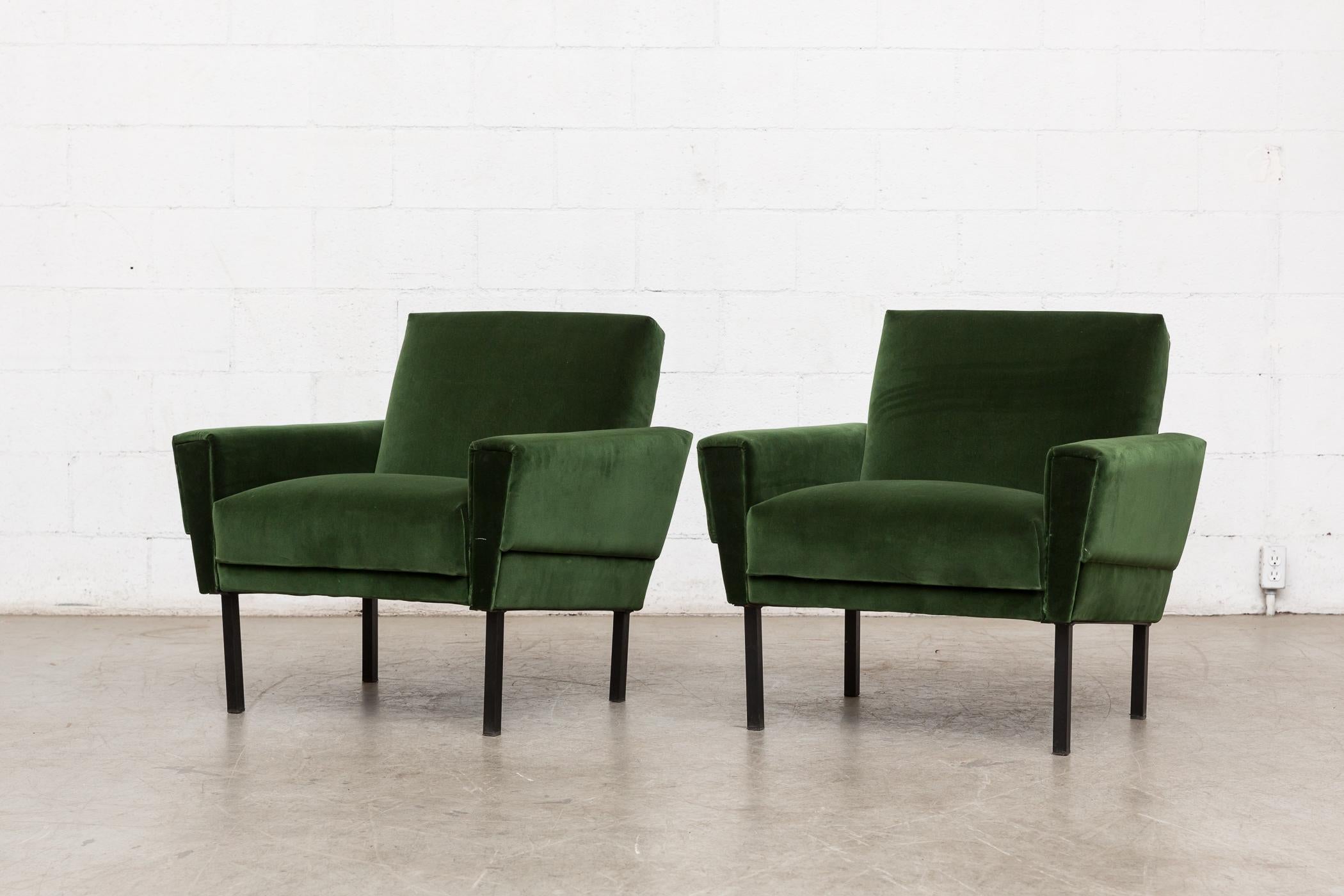 Pair of 1960s Gelderland style club chairs newly upholstered in emerald green velvet with black enameled metal legs. Legs in original condition with some wear. Set price.