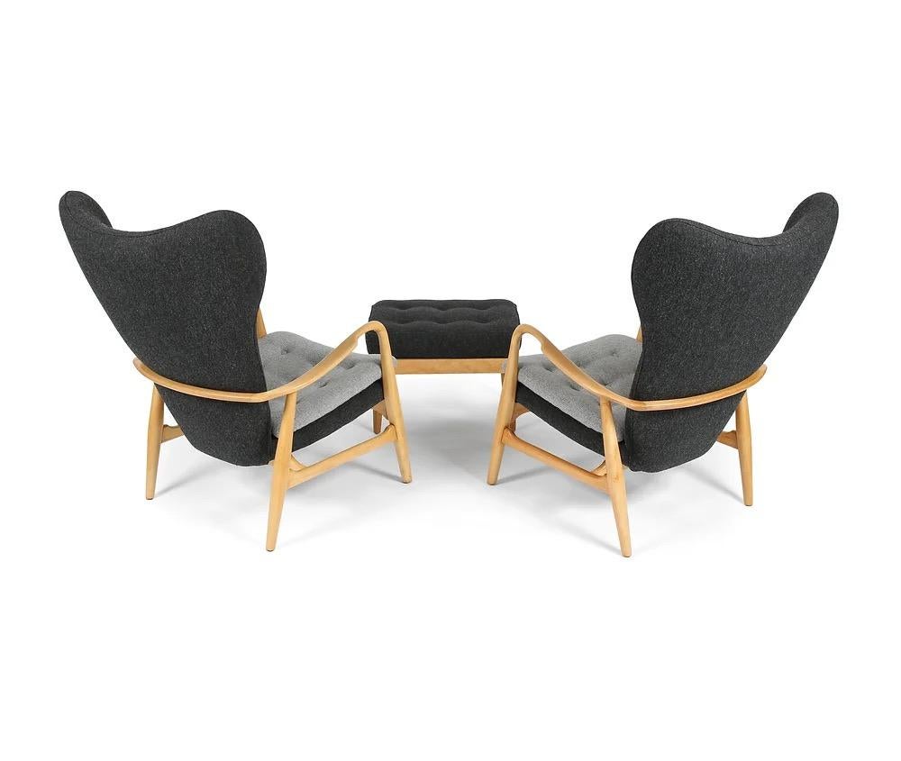 Here is a pair of MS-4 model wingback chairs with ottoman designed Henry Schubell, and produced in the 1950s by Madsen and Schubell in Denmark (this design was also licensed to Vik & Blindheim in Norway). These are the highback versions with beech