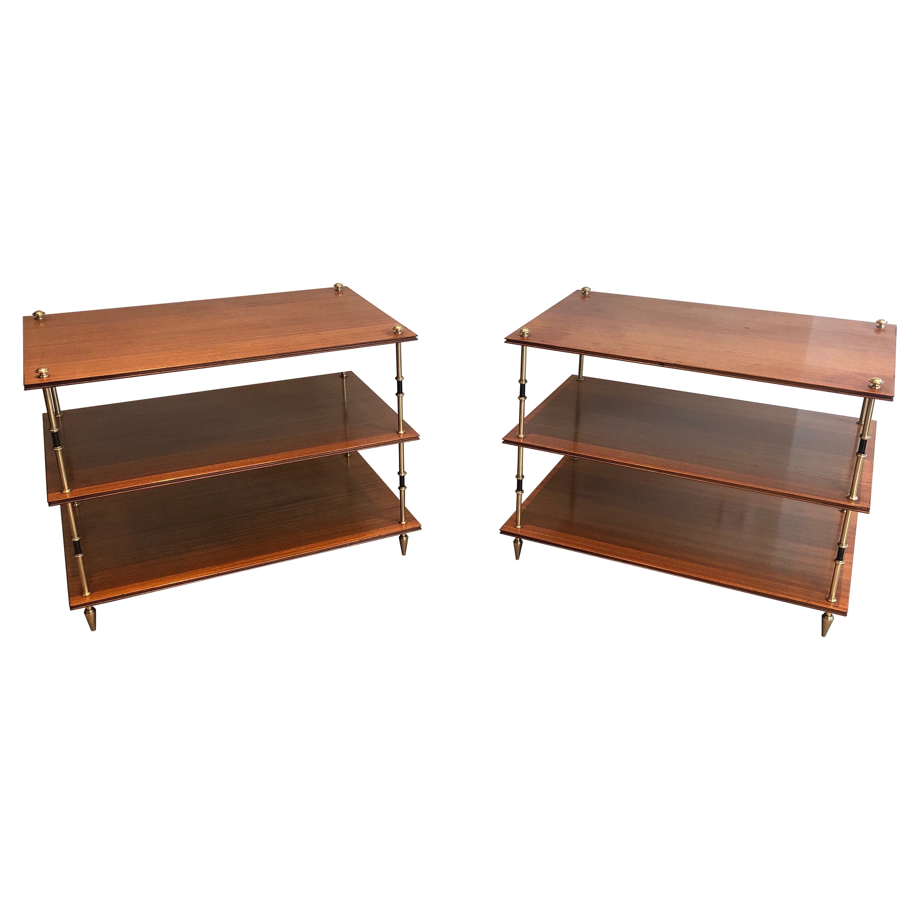 Pair of mahogany and brass three tiers console or side tables, Maison Jansen