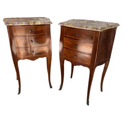 Pair of mahogany and marble topped night stands / bedside cabinets