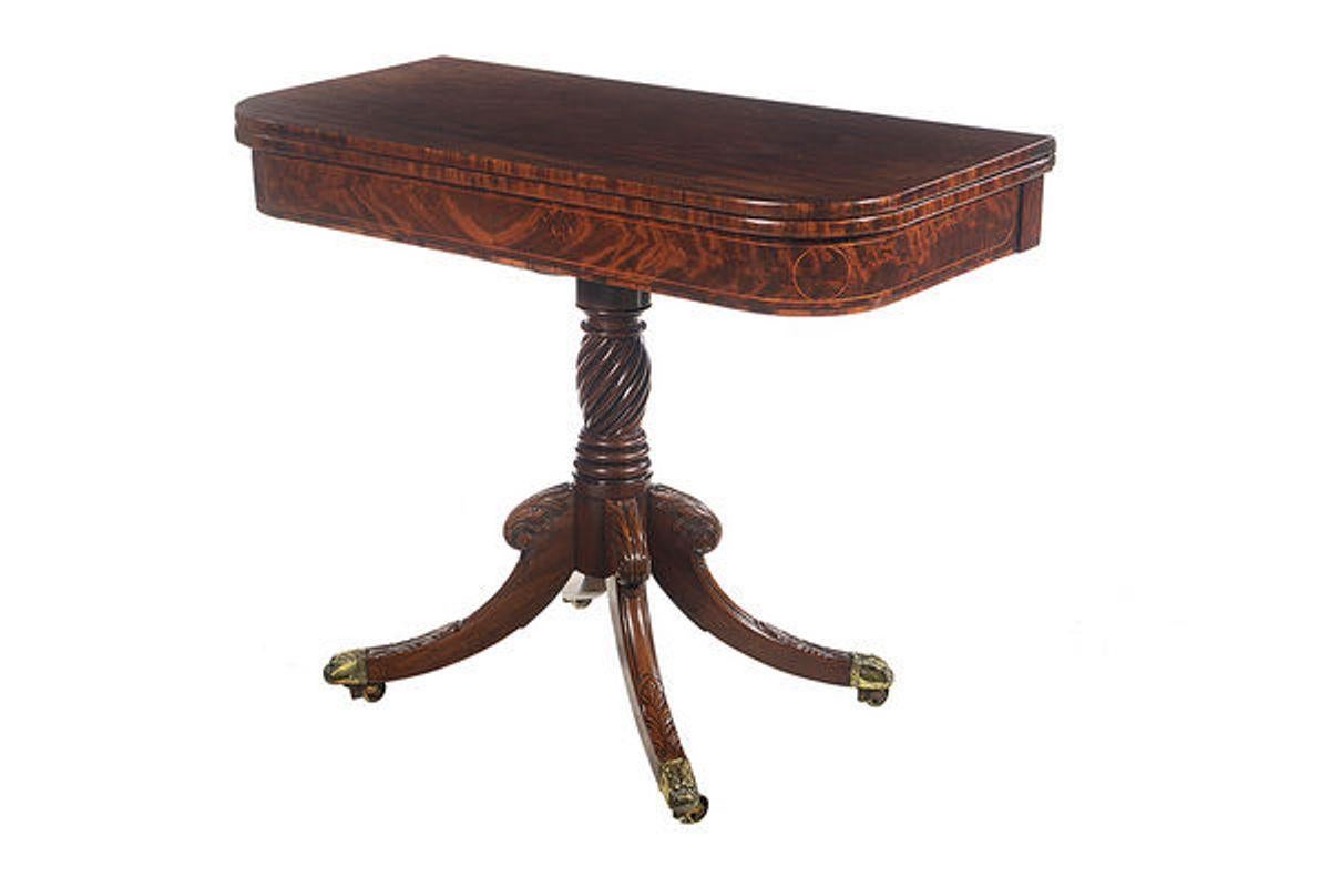 A beautiful pair of early 19th century side tables, one being for cards and the other for tea.
The well figured mahogany tops with satinwood line inlays, are raised on a twisted and turned column that unites with four hipped and splayed legs that