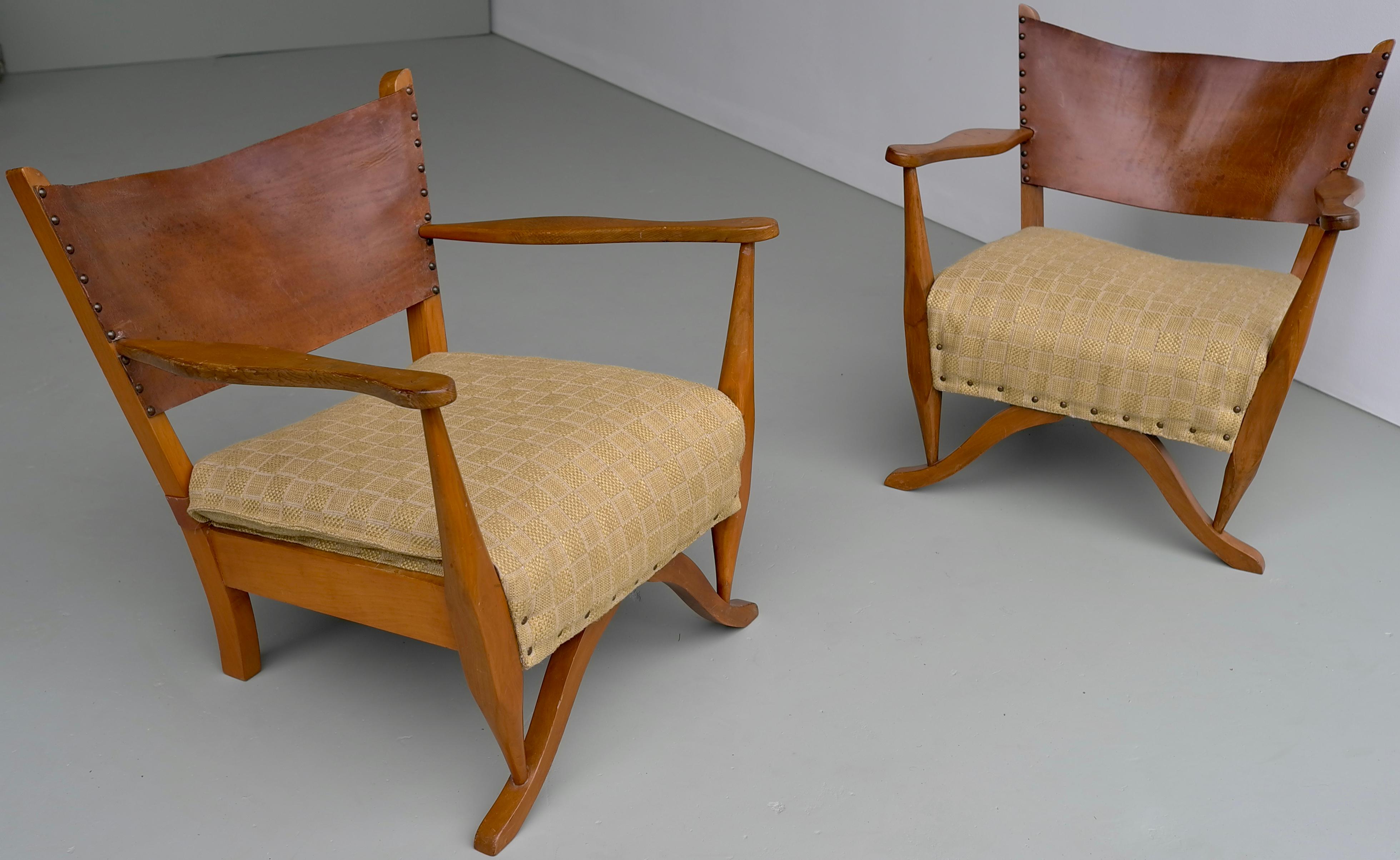 Pair of mahogany armchairs with natural sling leather back, Denmark 1960s.
