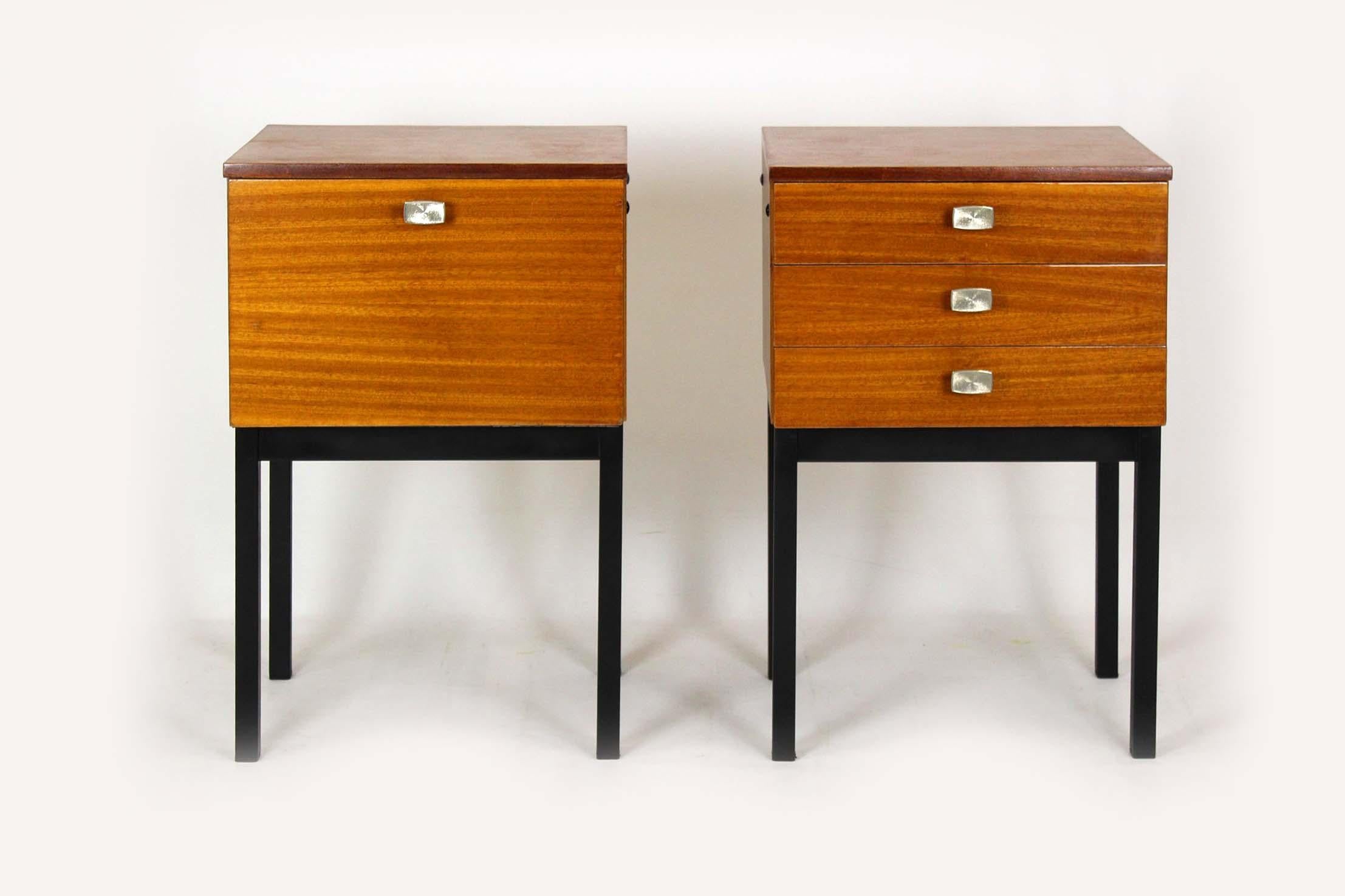 This pair of bedside cabinets was produced by UP Závody in Czechoslovakia during the 1970s. They are finished with mahogany veneer and stand on slender metal legs that give them a light, modern profile. The pieces are in very good overall condition,